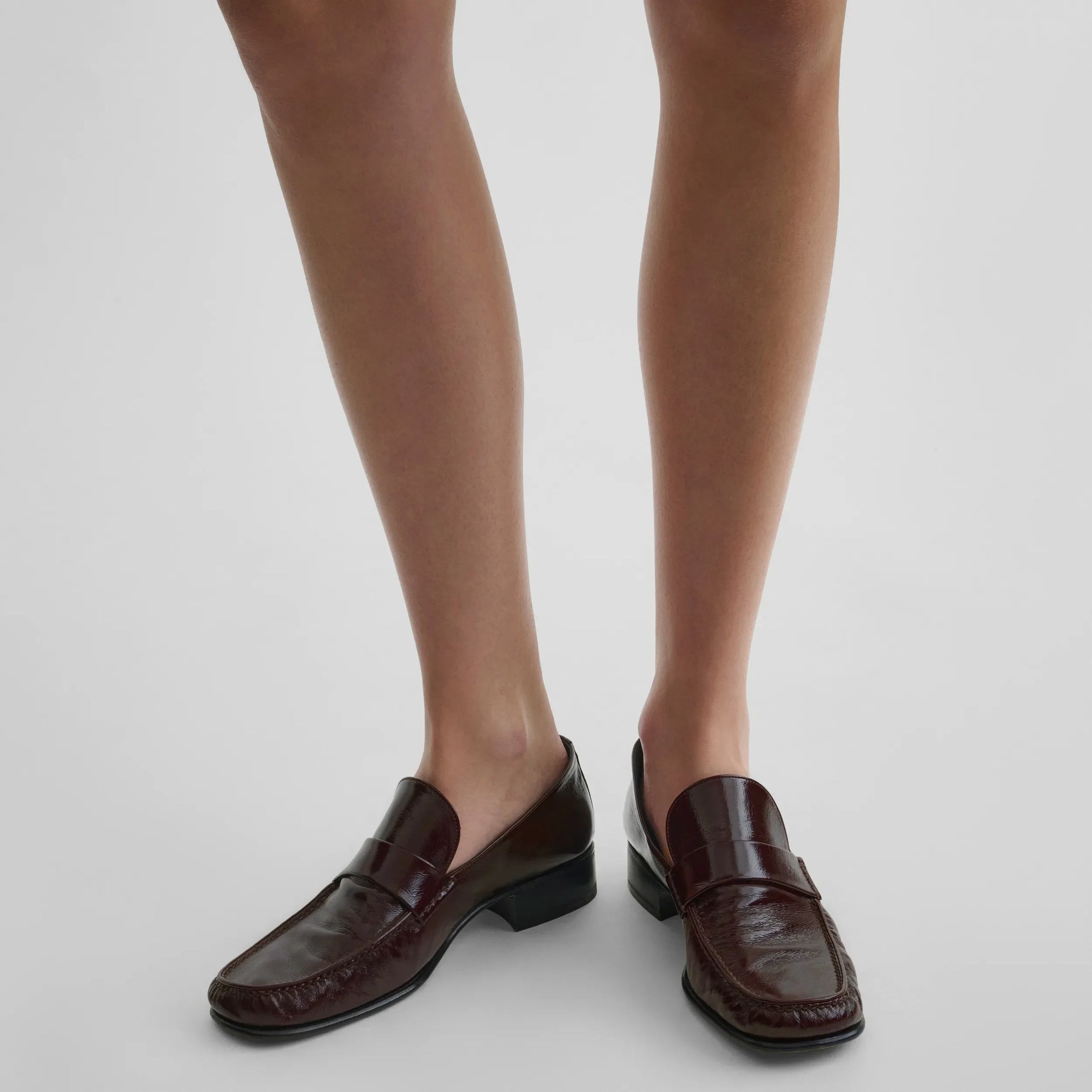 Top view of model wearing man&#39;s loafer in oxblood leather