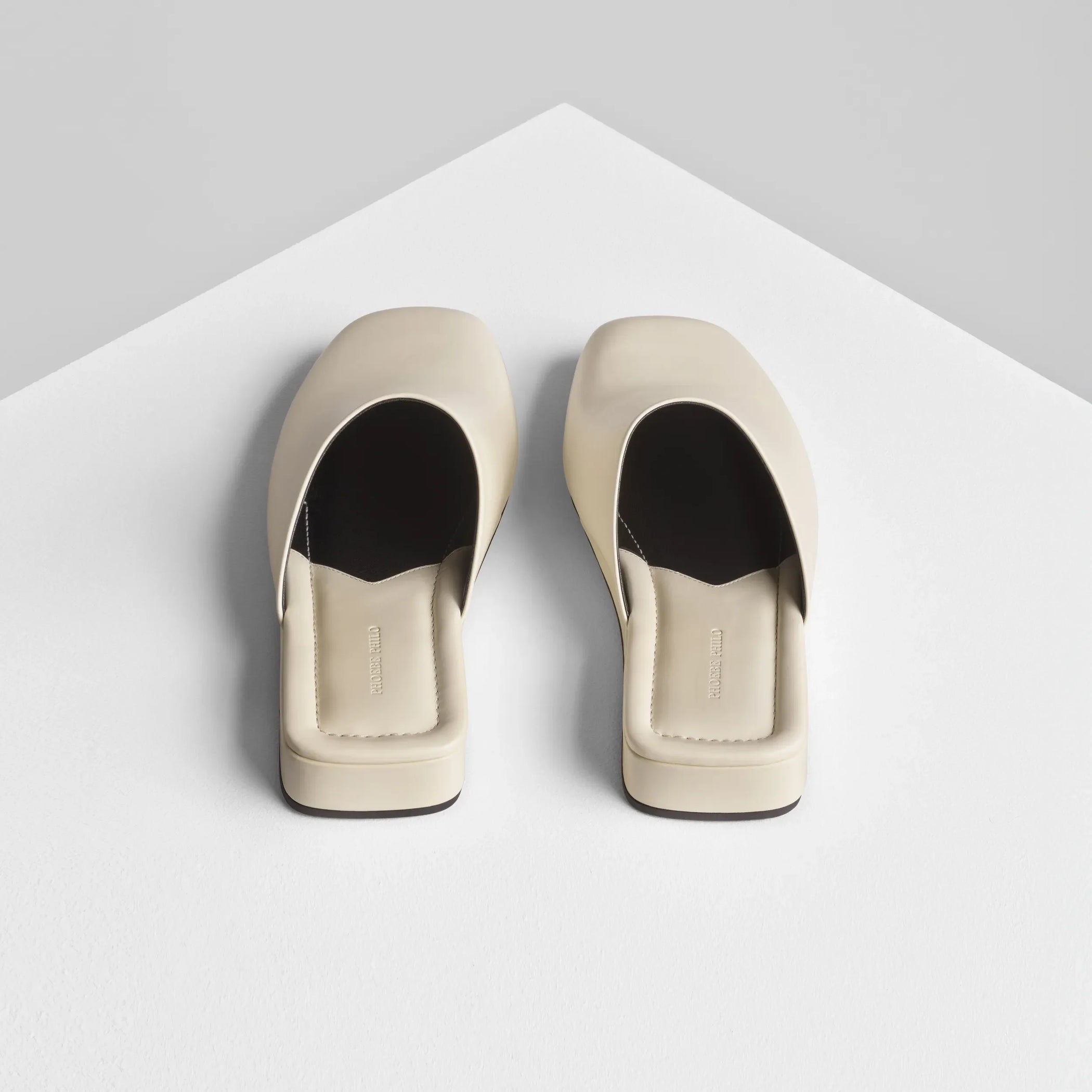 Back view of robe slide in cream leather.
