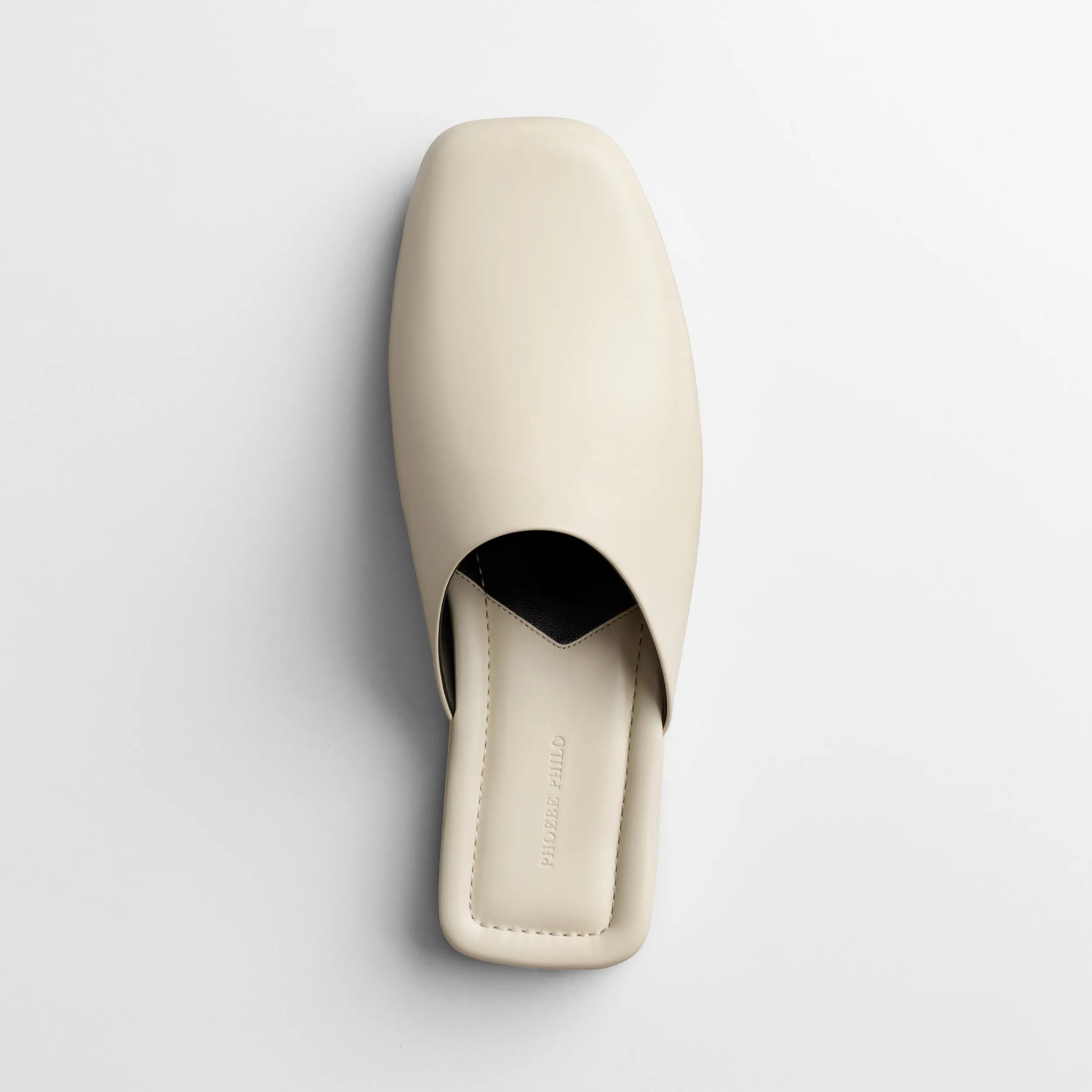 Top view of robe slide in cream leather.