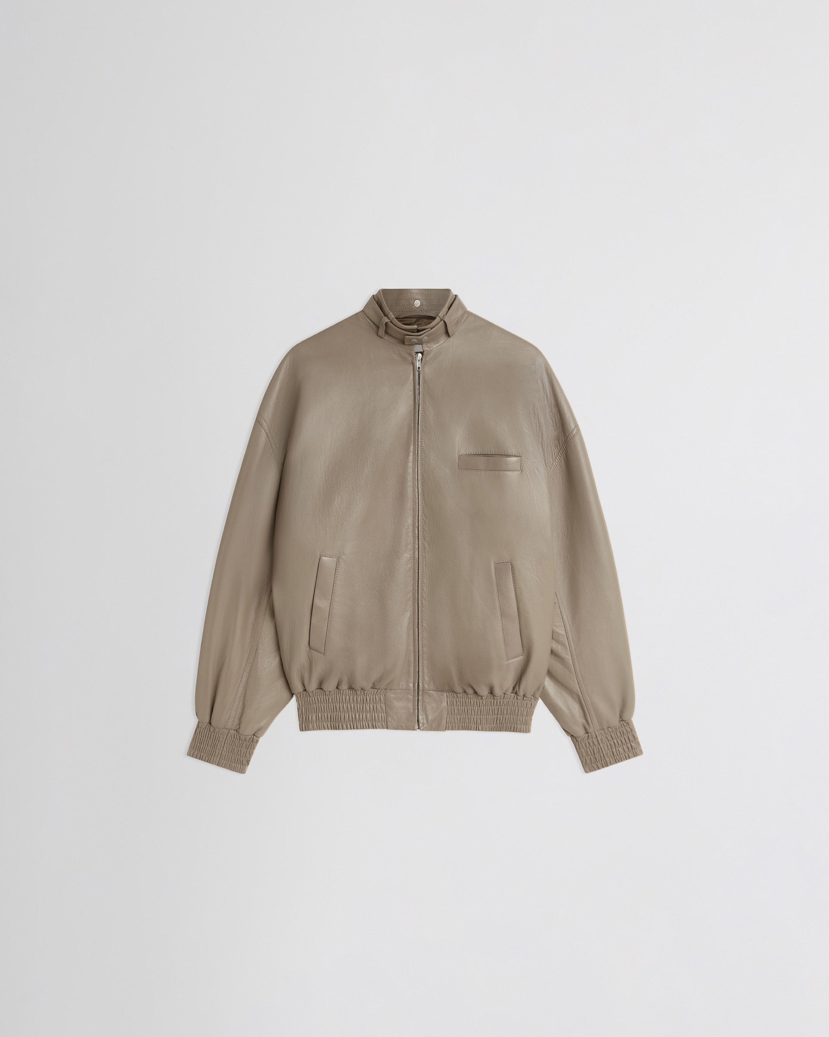 Flat front view of attachable scarf in mastic leather