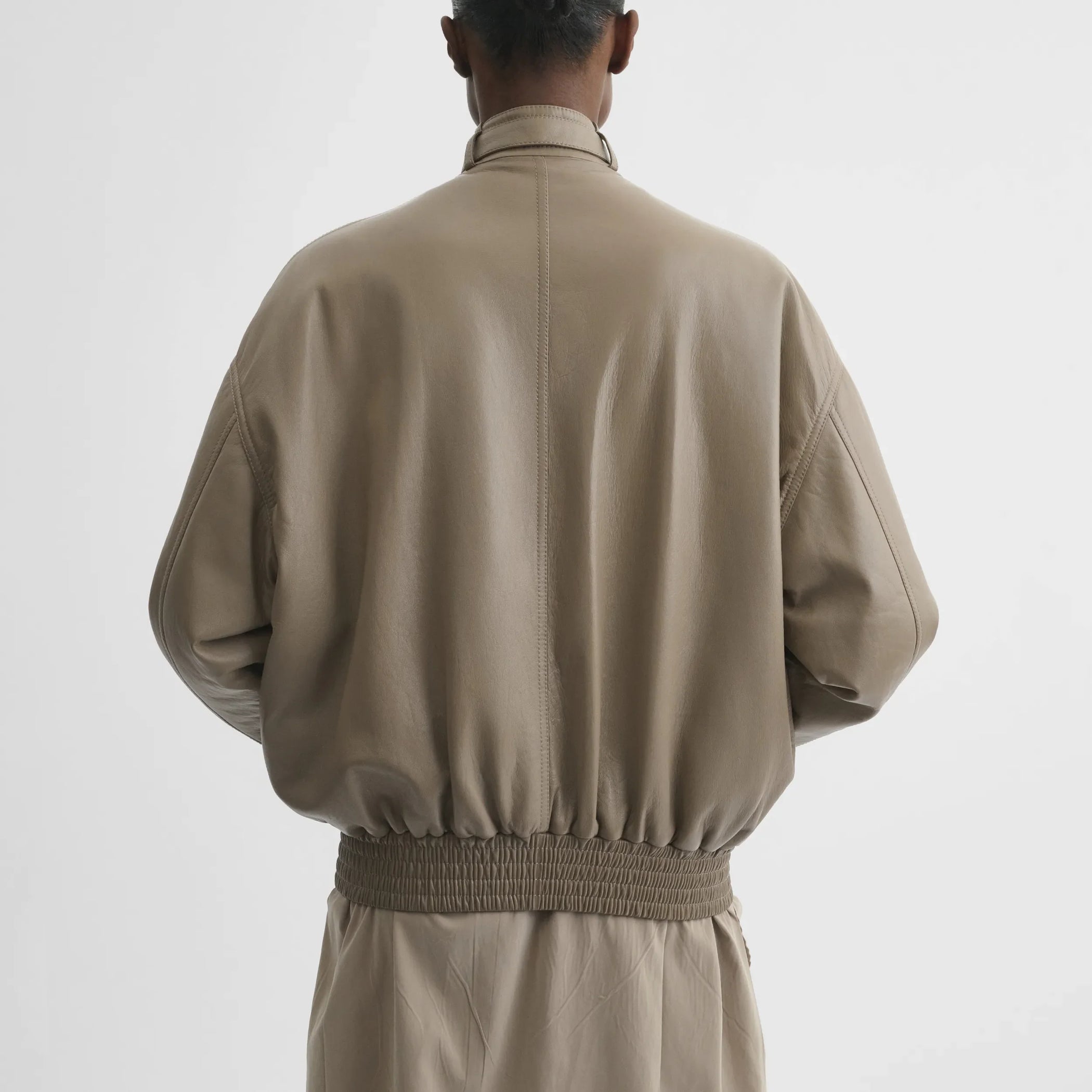 Back view of jacket with attachable scarf in mastic leather