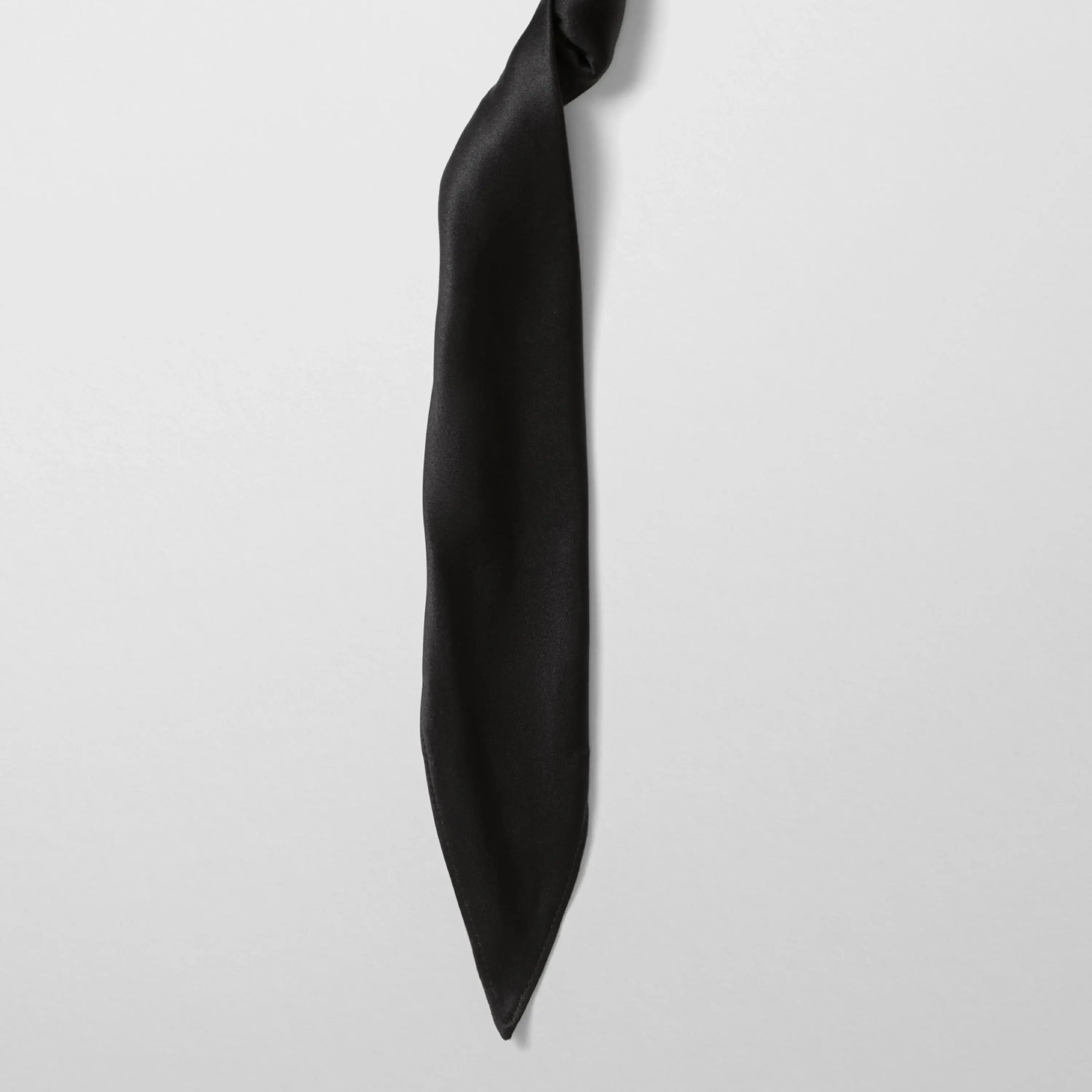 Close up detail view of twisted scarf in black satin