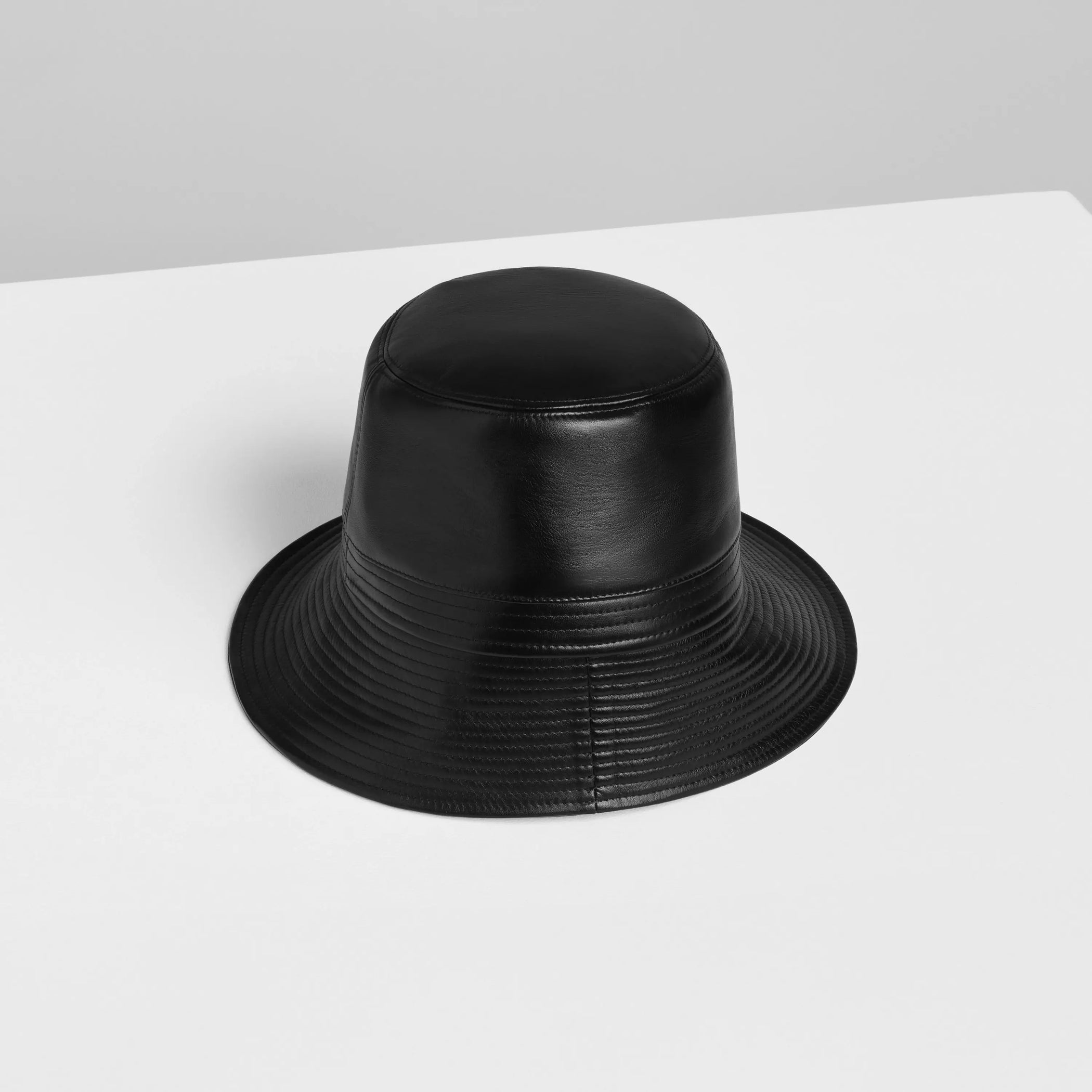 Flat back view of BUCKET HAT in black leather