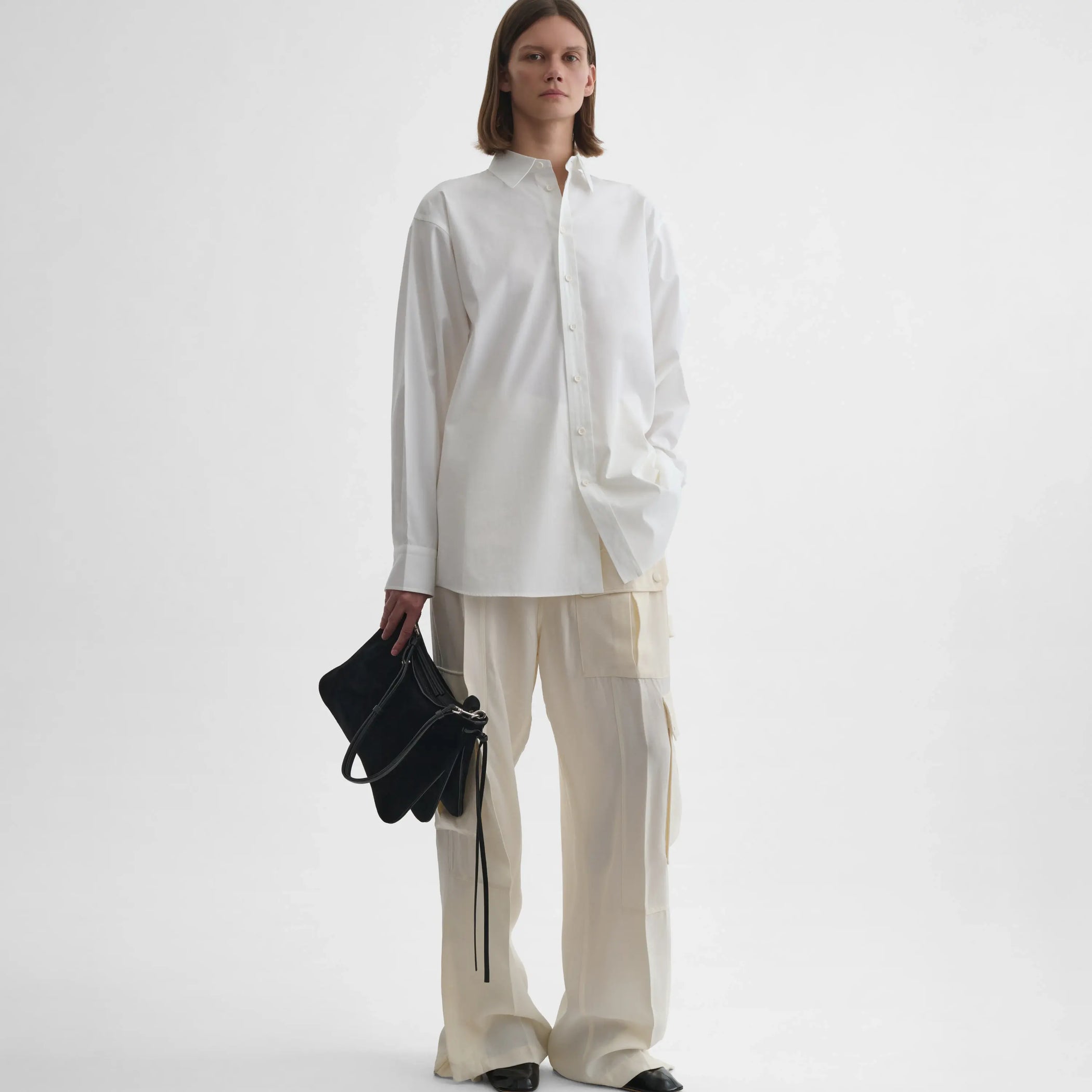 Full body front view of model wearing Sharp Collar Shirt in white.