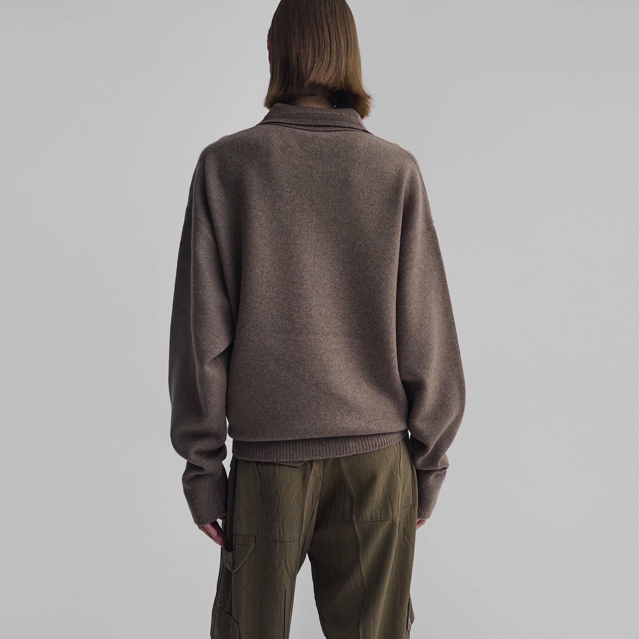 Back view of model wearing SOFT SHIRT COLLAR JUMPER in dun