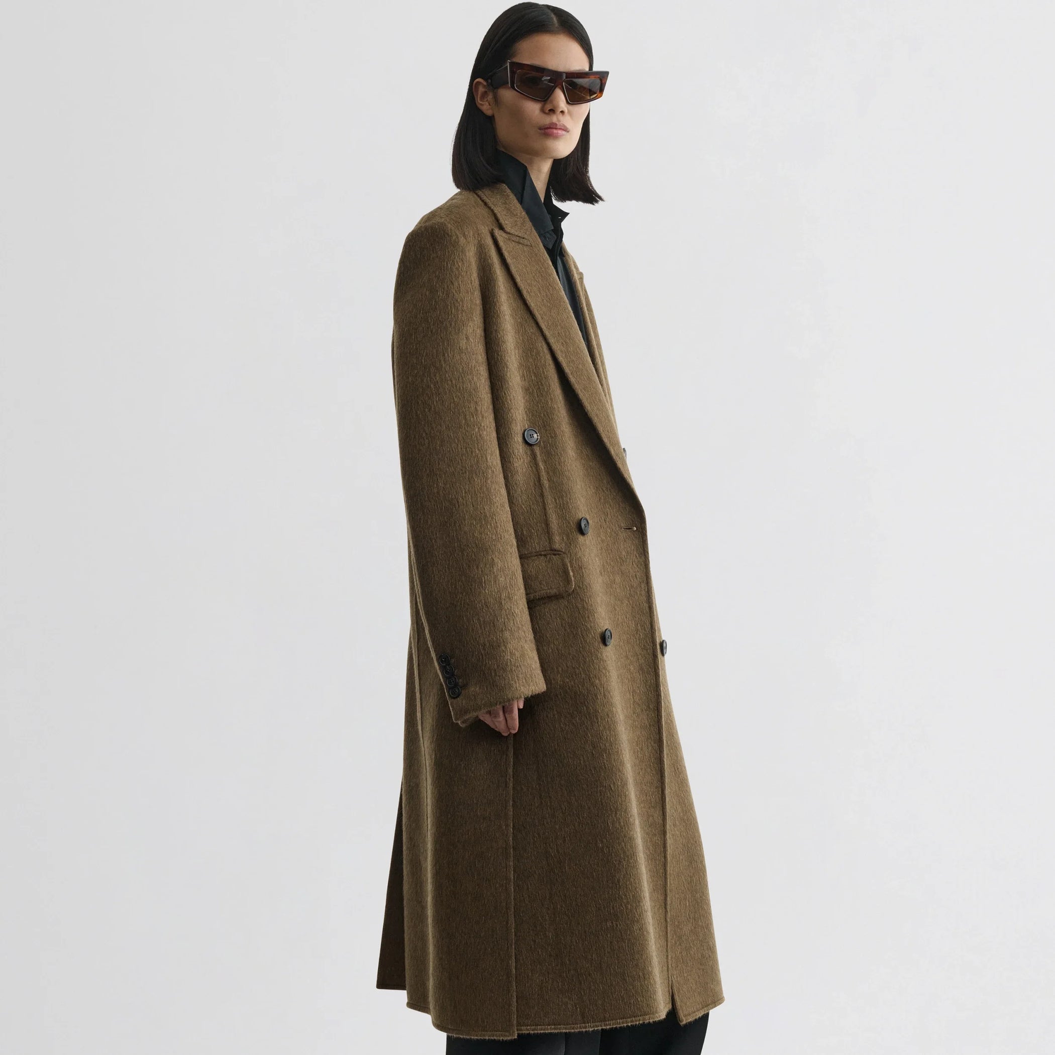 Front view of model wearing man&#39;s coat in bronze khaki wool mohair.