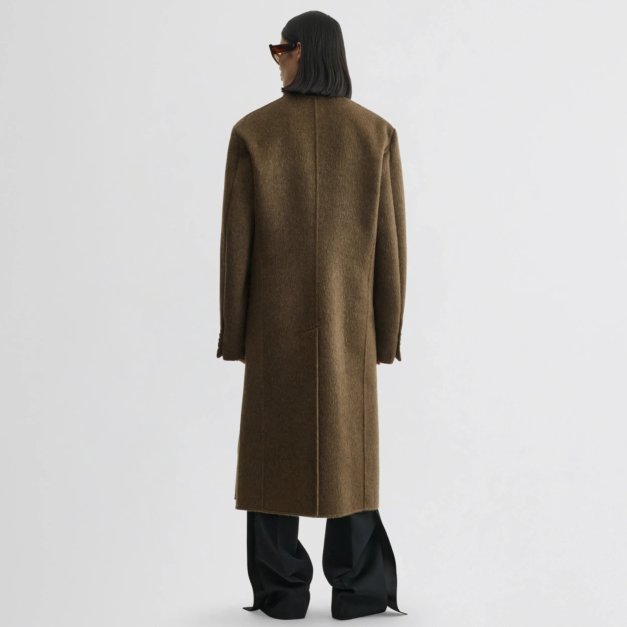 Close up detail view of man&#39;s coat in bronze khaki wool mohair.