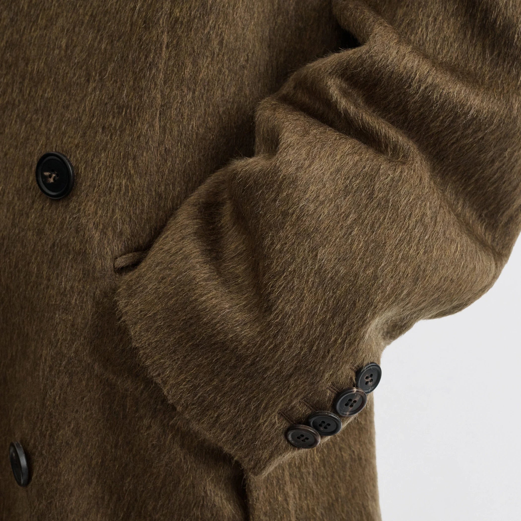 Flat back view of man&#39;s coat in bronze khaki wool mohair.