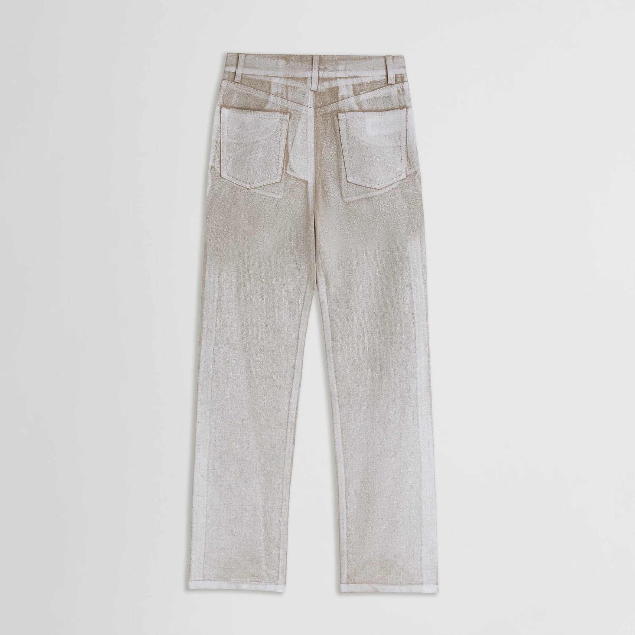 Flat lay back view of classic jeans in hay