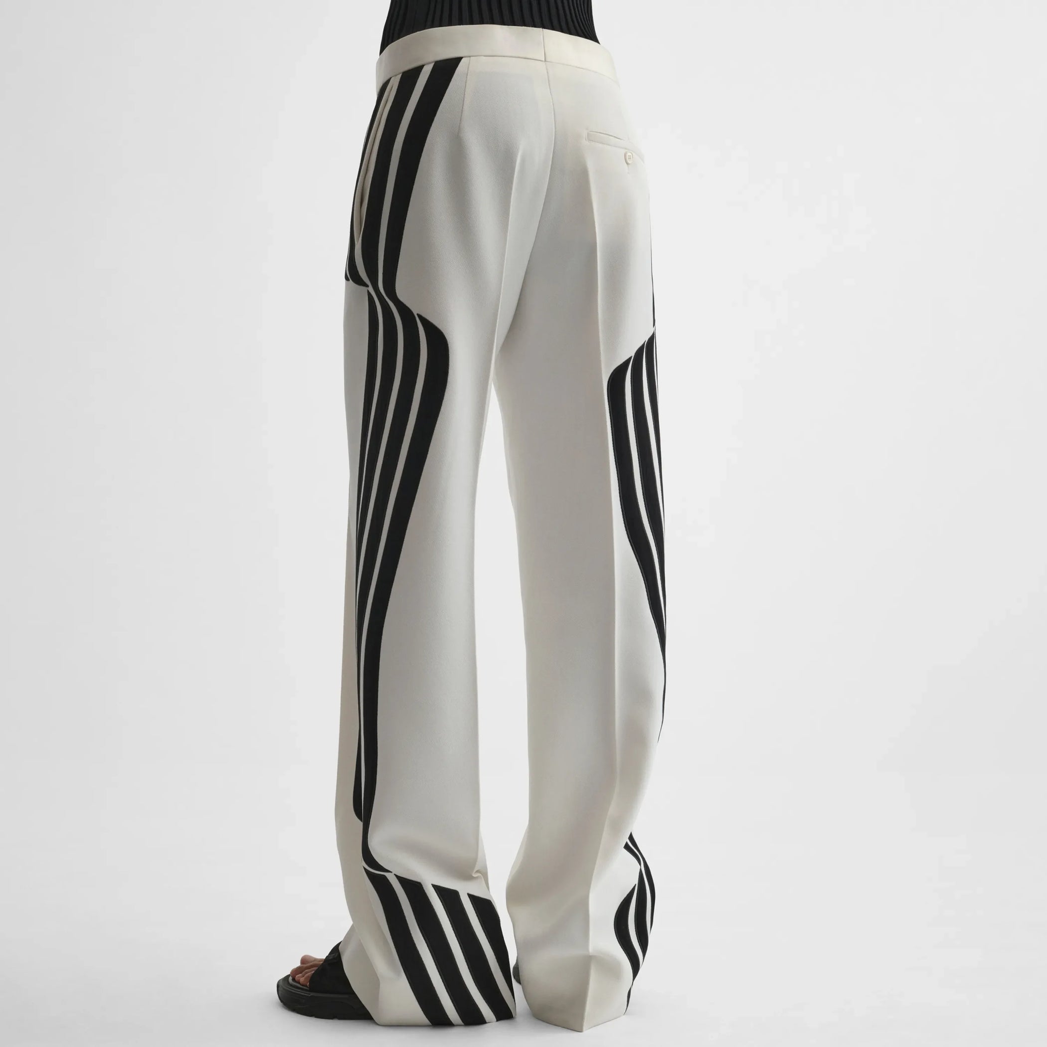Back view of wave trousers in black and white technical tailoring