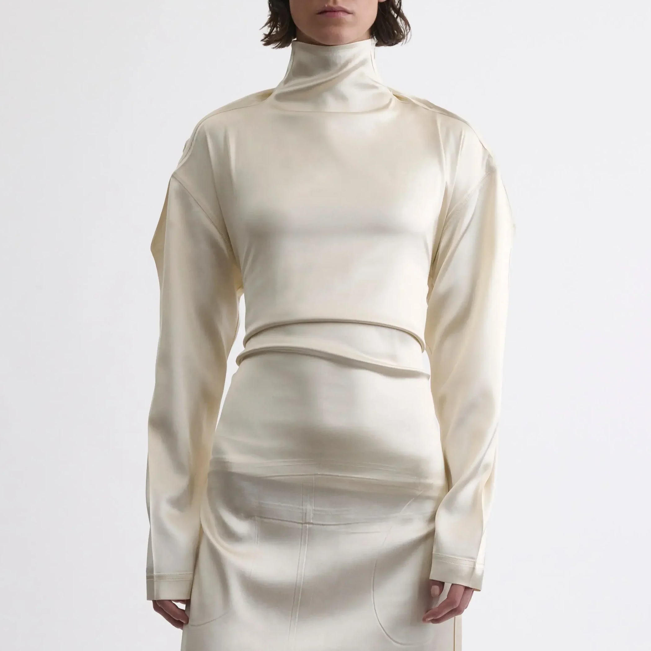 Close up font view of model wearing LIQUID OPEN BACK DRESS in cream silk satin