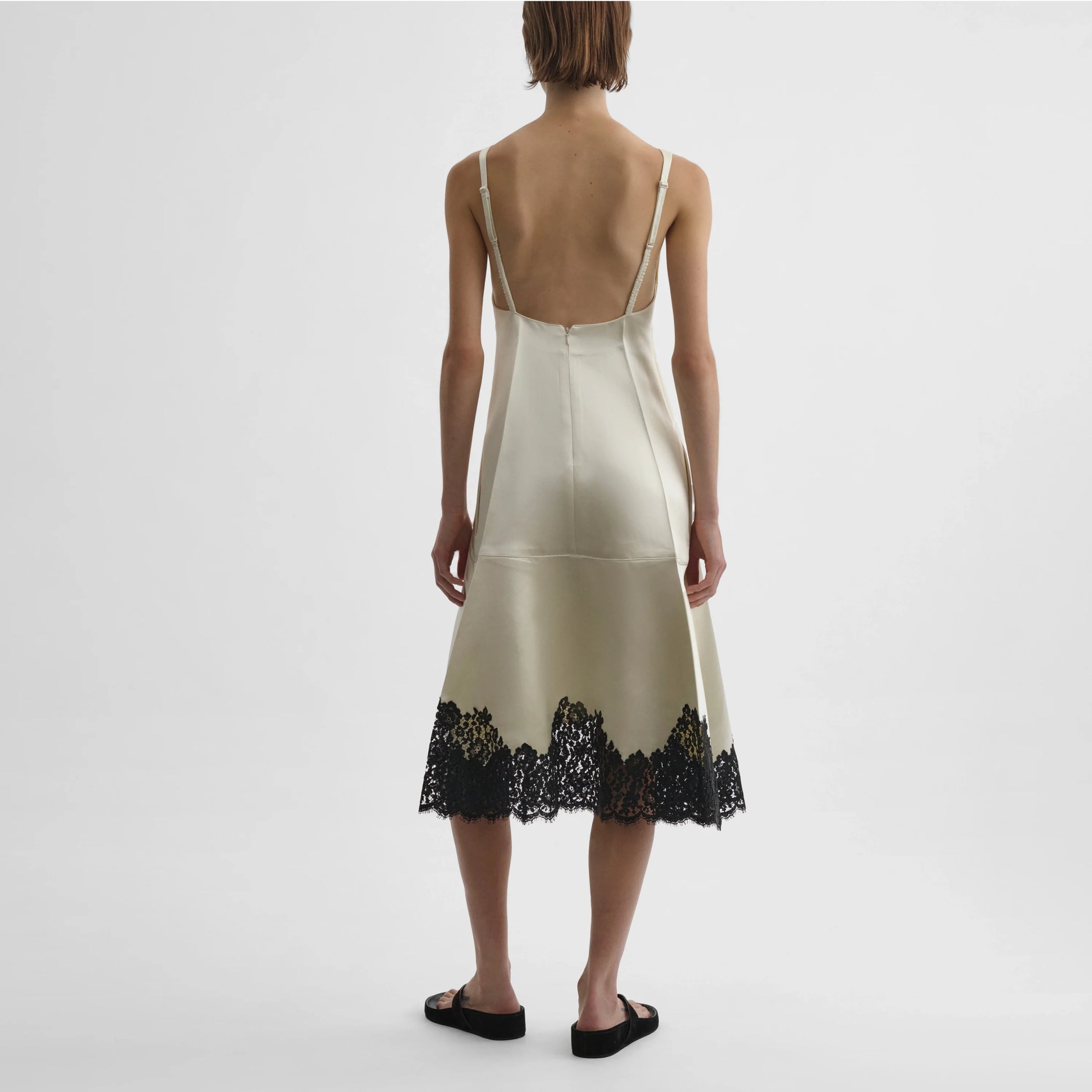 Back view of model wearing the slicked slip in vanilla
