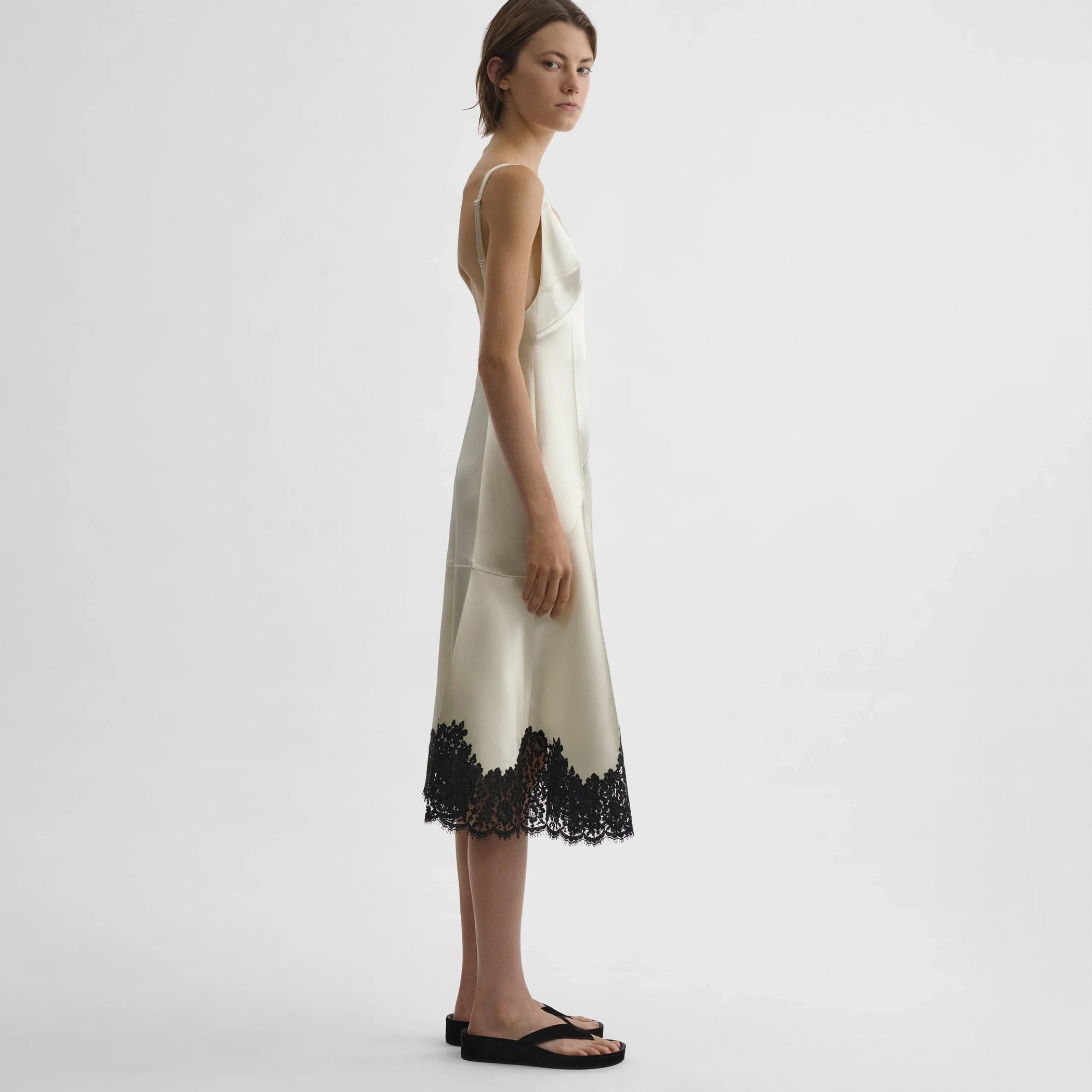 Side view of model wearing the slicked slip in vanilla