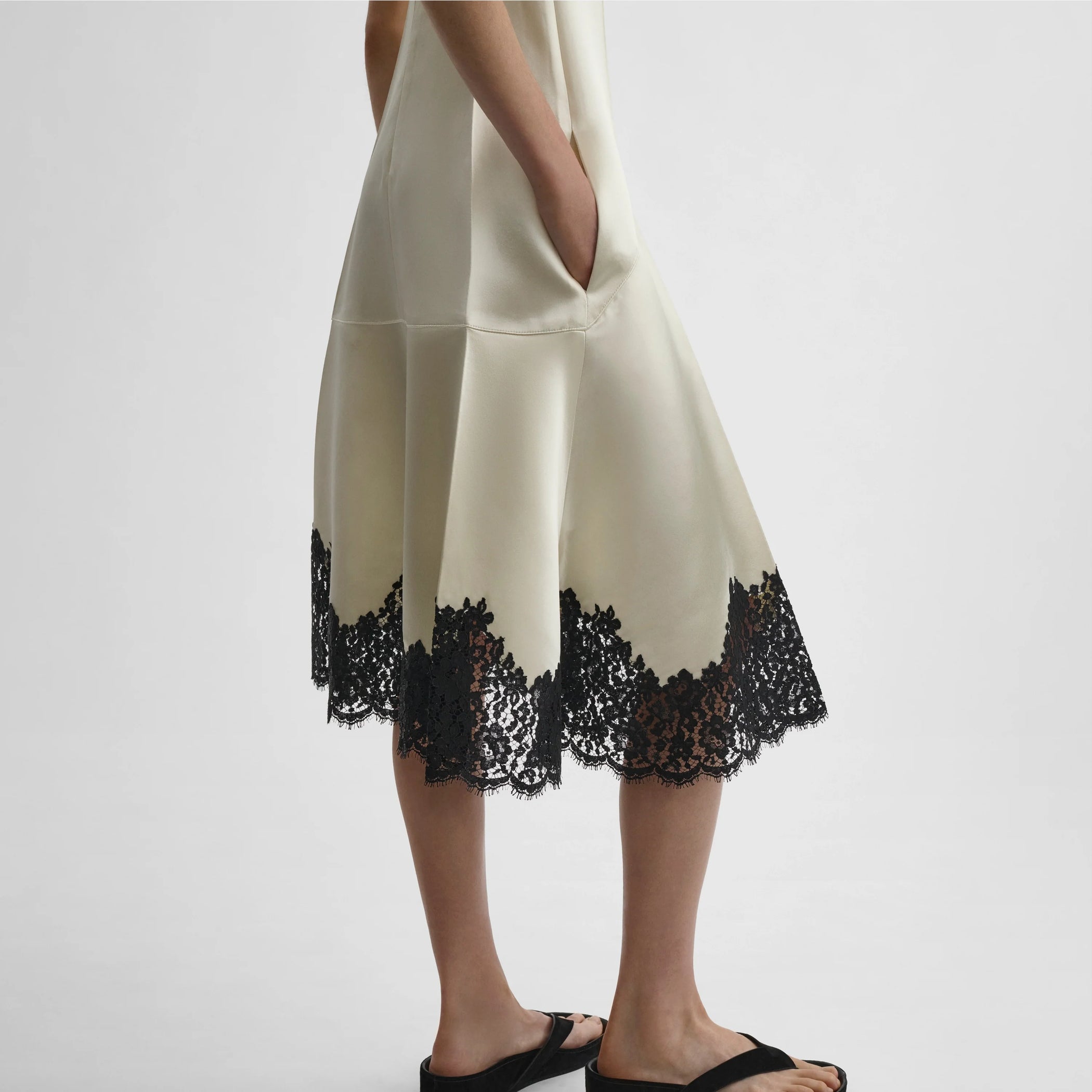 Detailed side view of model wearing the slicked slip in vanilla