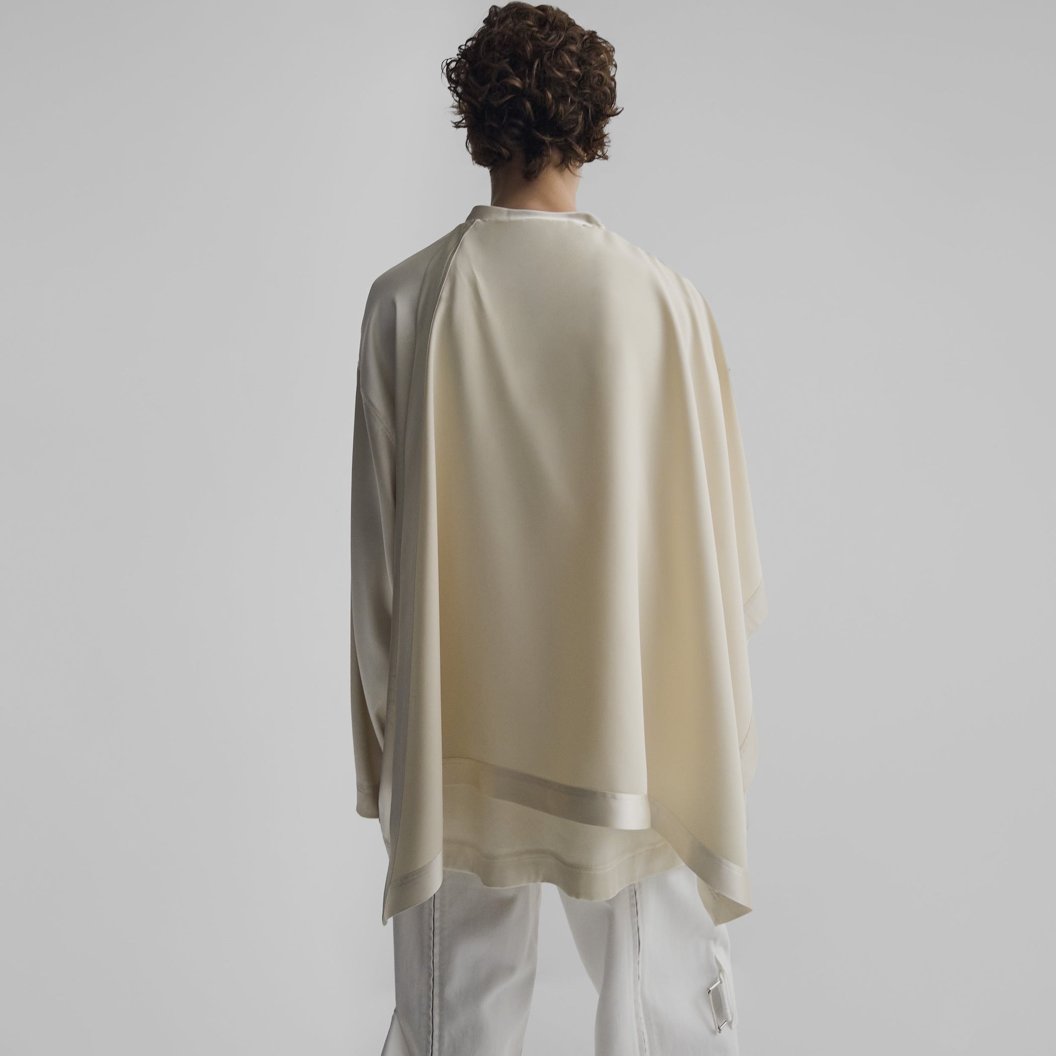 Back view of model wearing SCARF TOP in stucco silk satin