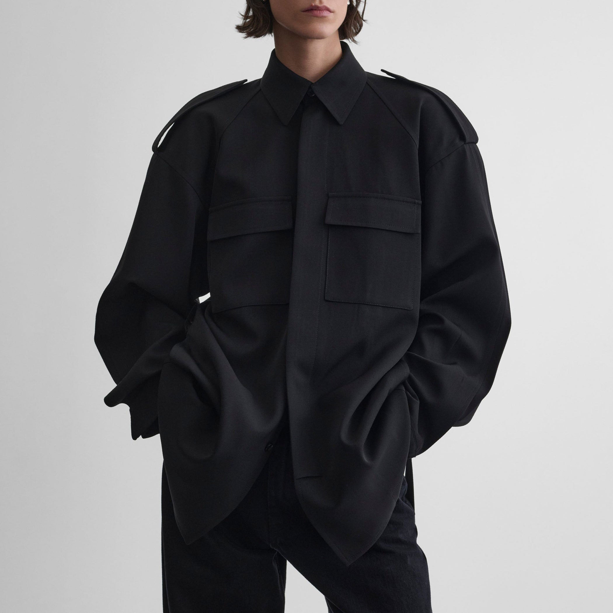 Front view of model wearing LIGHTWEIGHT SHIRT JACKET in black wool