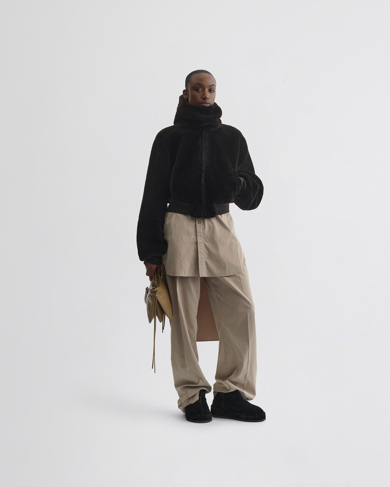 Front view of model wearing Super Soft Bomber Jacket in deep brown shearling