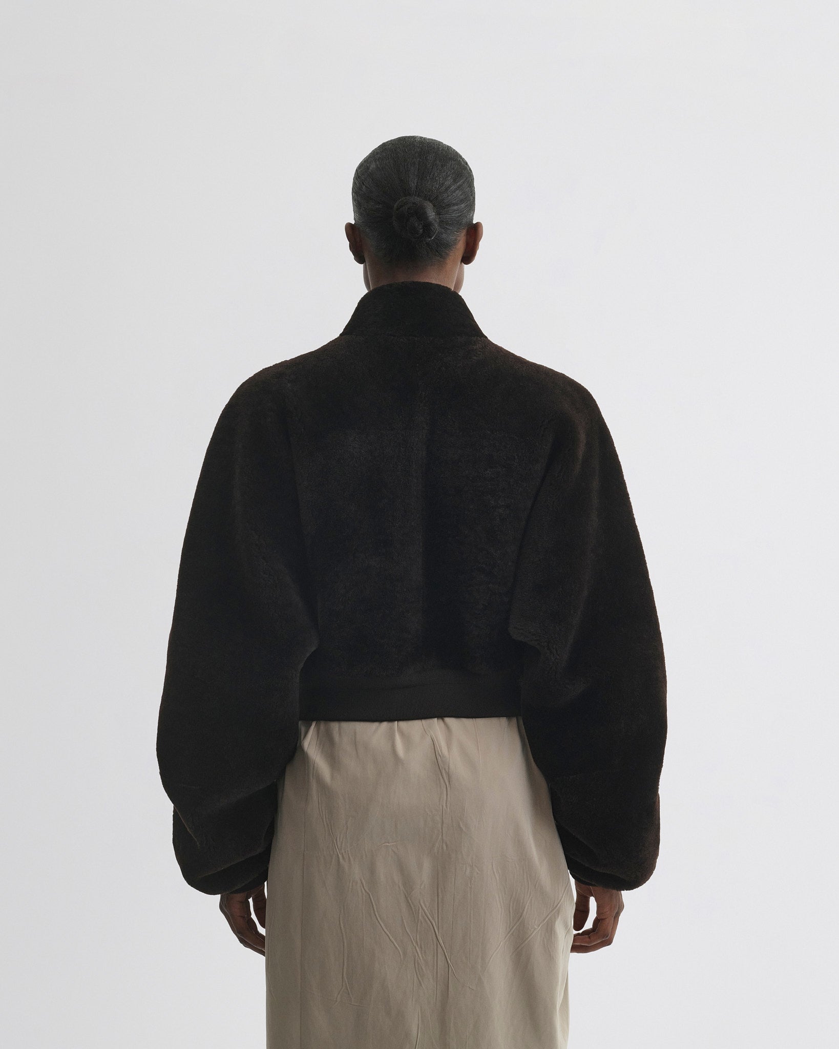 Back view of Super Soft Bomber Jacket in deep brown shearling