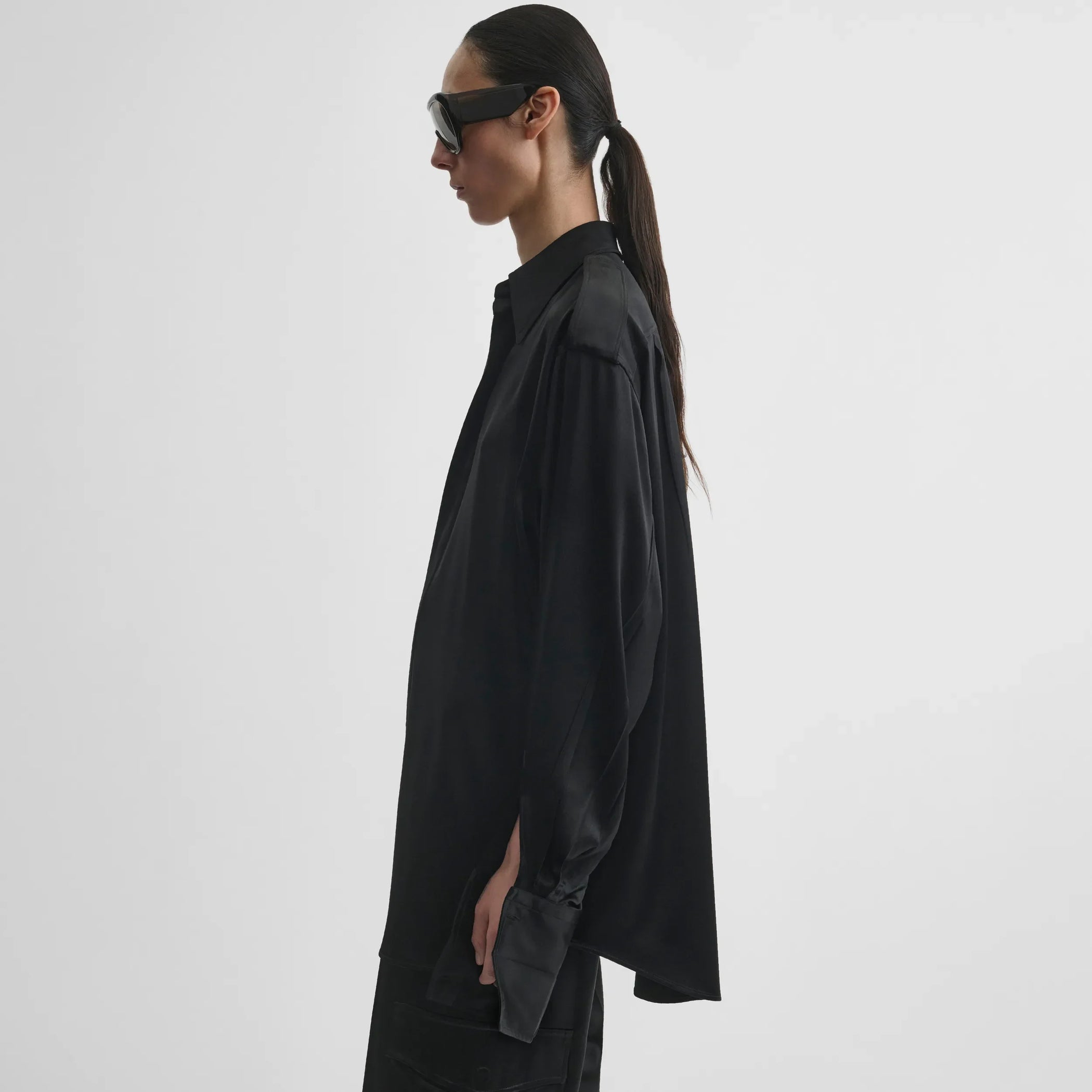 Side model view of liquid utility shirt in black silk satin