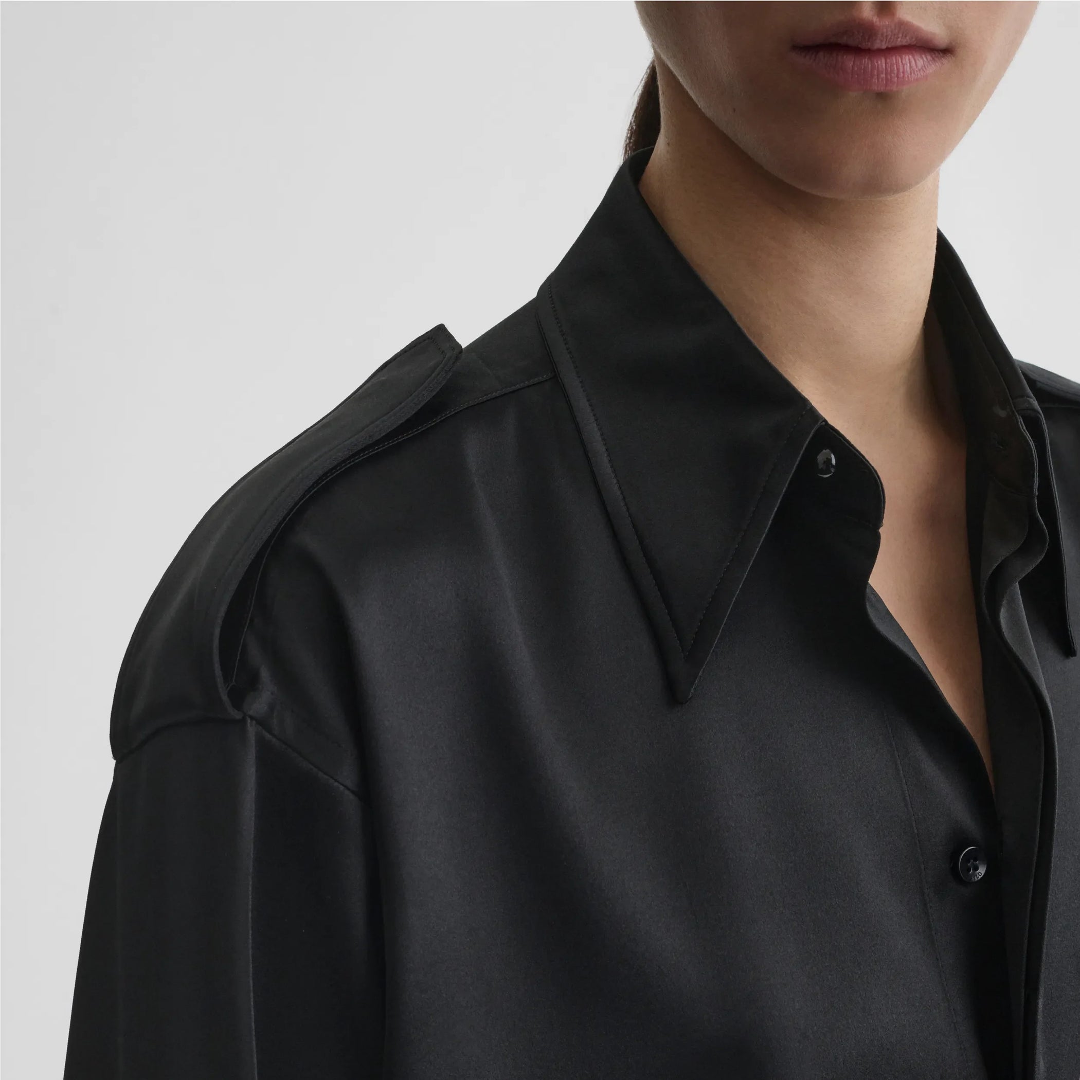 Front model detail shot view of liquid utility shirt in black silk satin