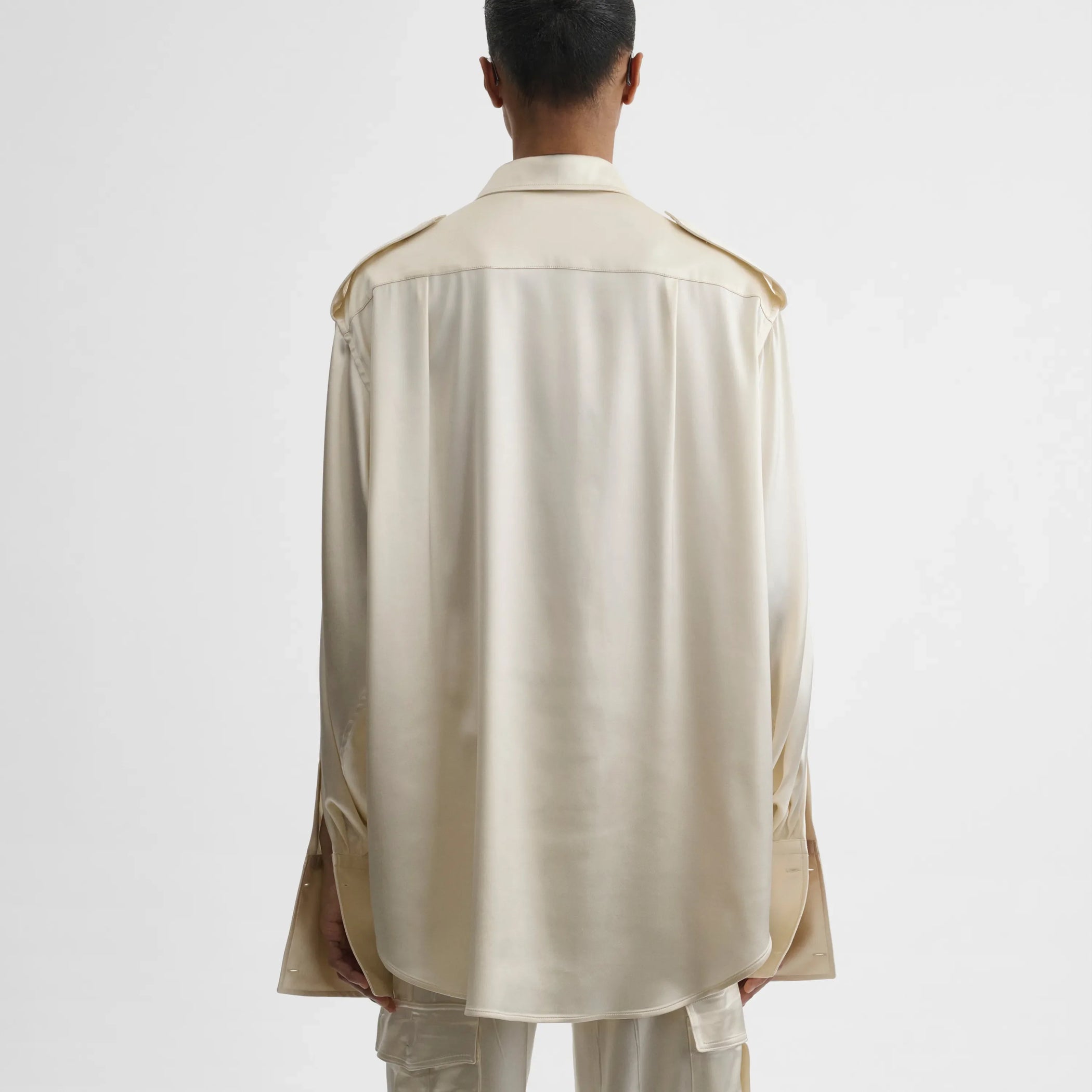 Back view of liquid utility shirt in cream silk