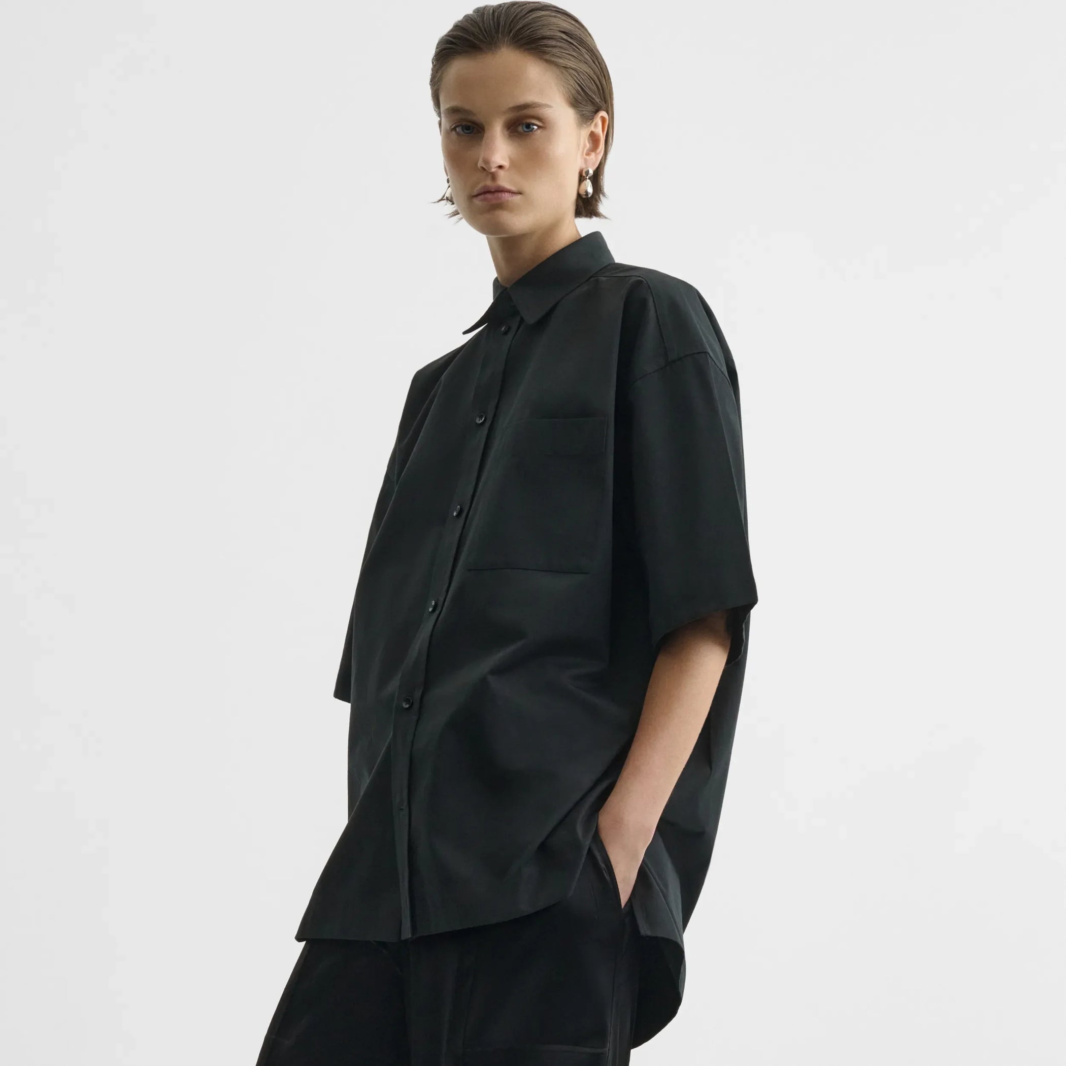 Side view of short sleeve shirt in black cotton