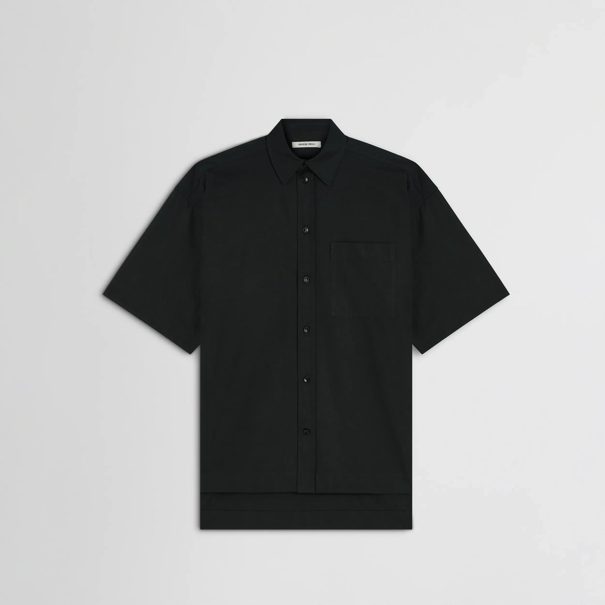 Flat front view of short sleeve shirt in black cotton