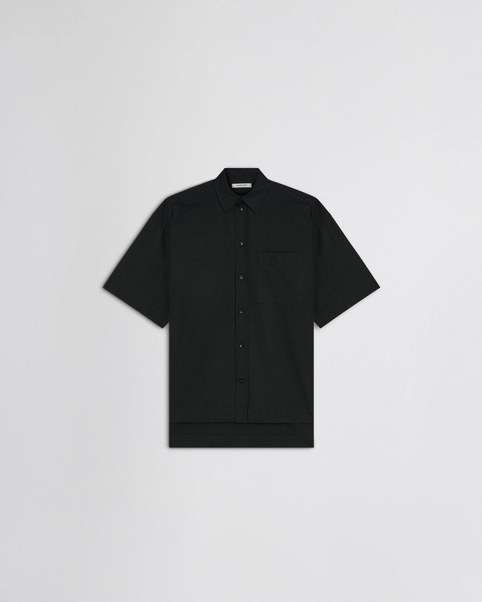 Flat front view of short sleeve shirt in black cotton
