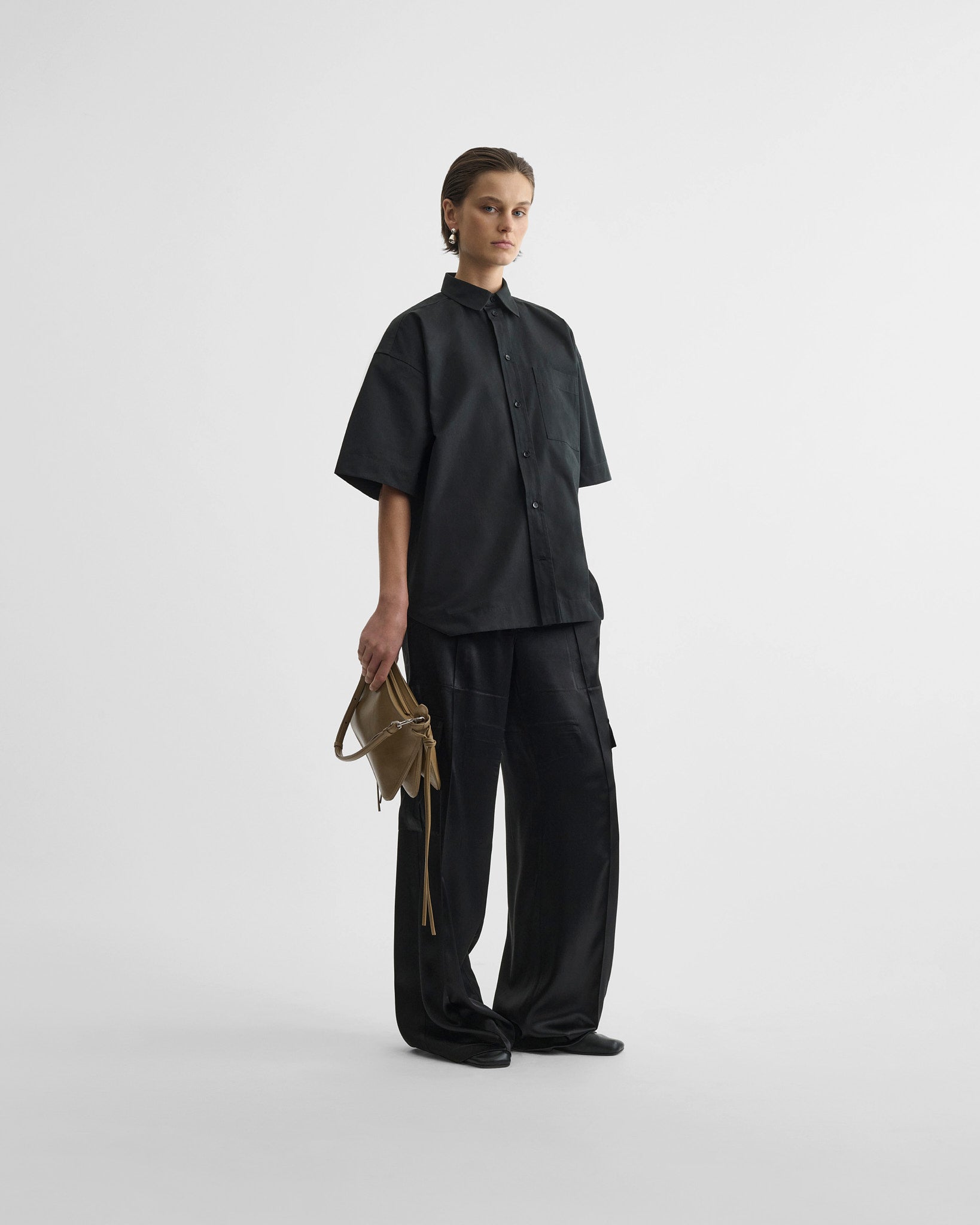 Front view of short sleeve shirt in black cotton