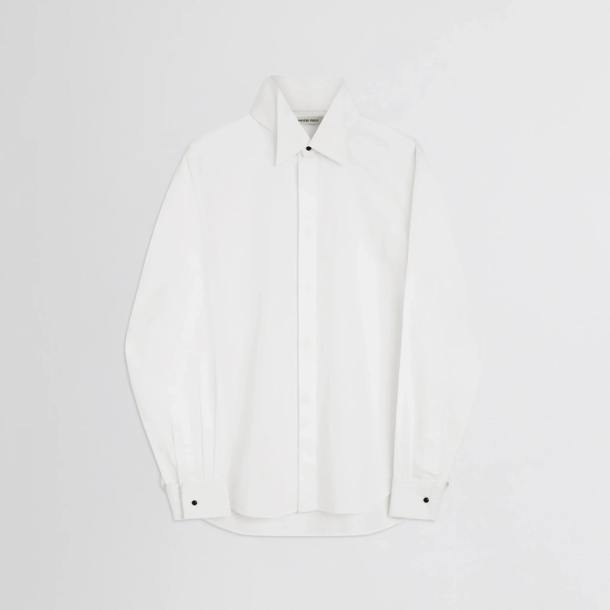 Flat front view of tuxedo shirt in white cotton.