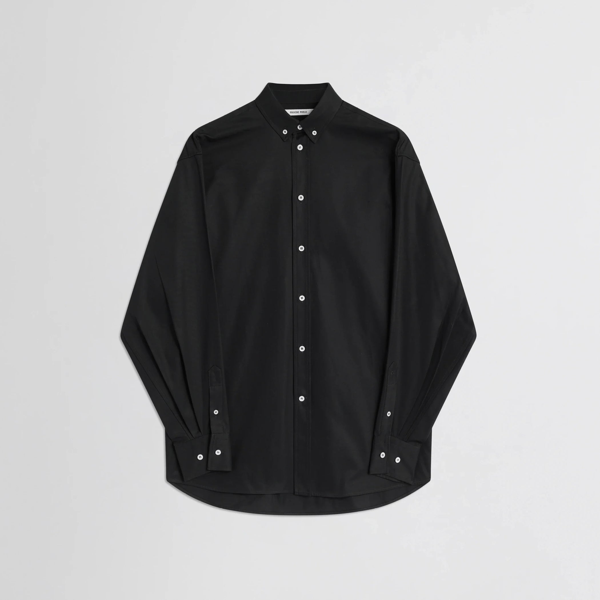 Flat front view of button collar shirt in black cotton.