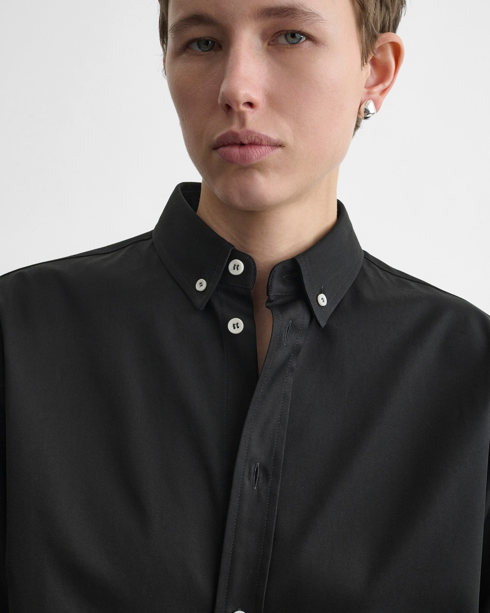 Close up detail view of button collar shirt in midnight pinstripe cotton.