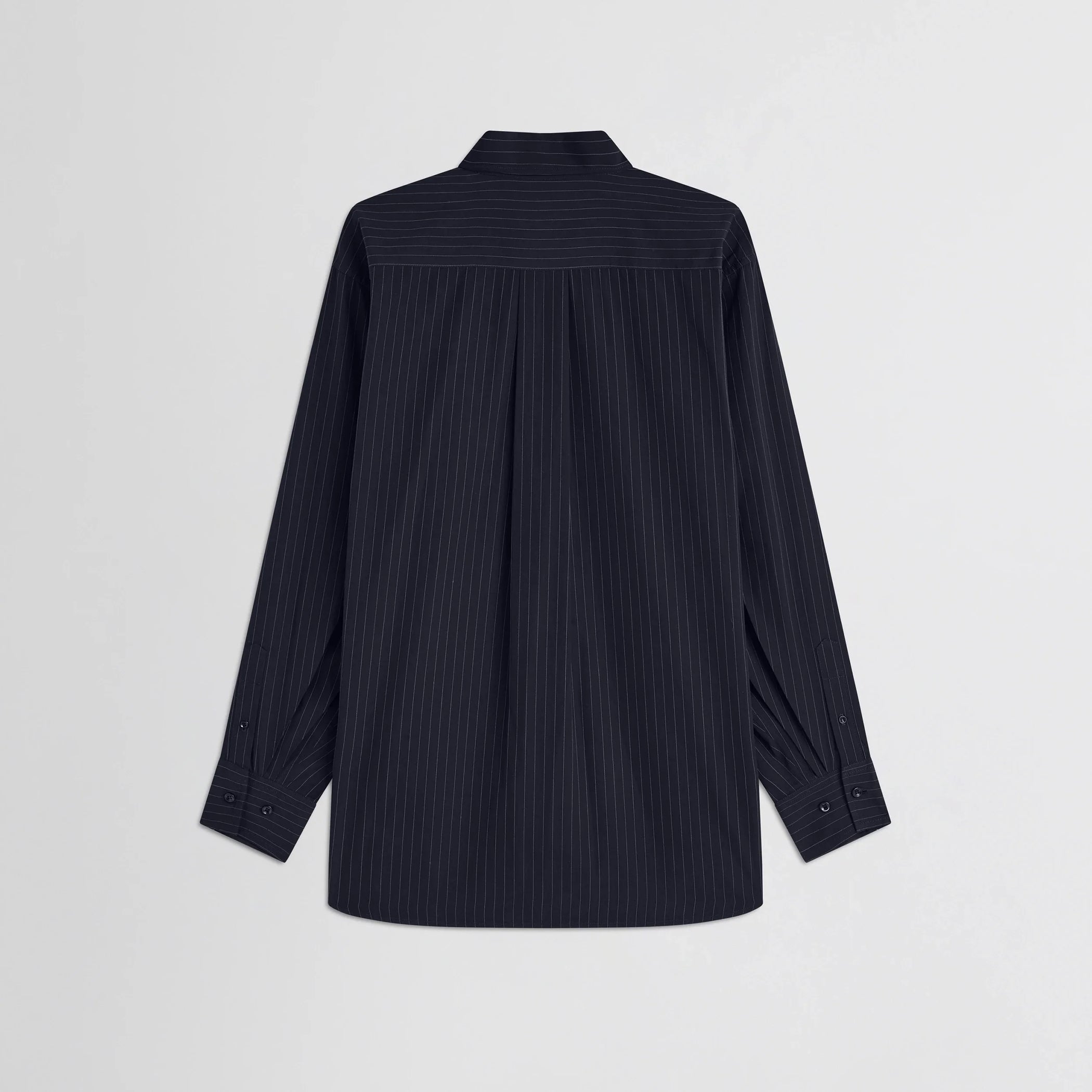 Flat back view of button collar shirt in midnight pinstripe cotton.