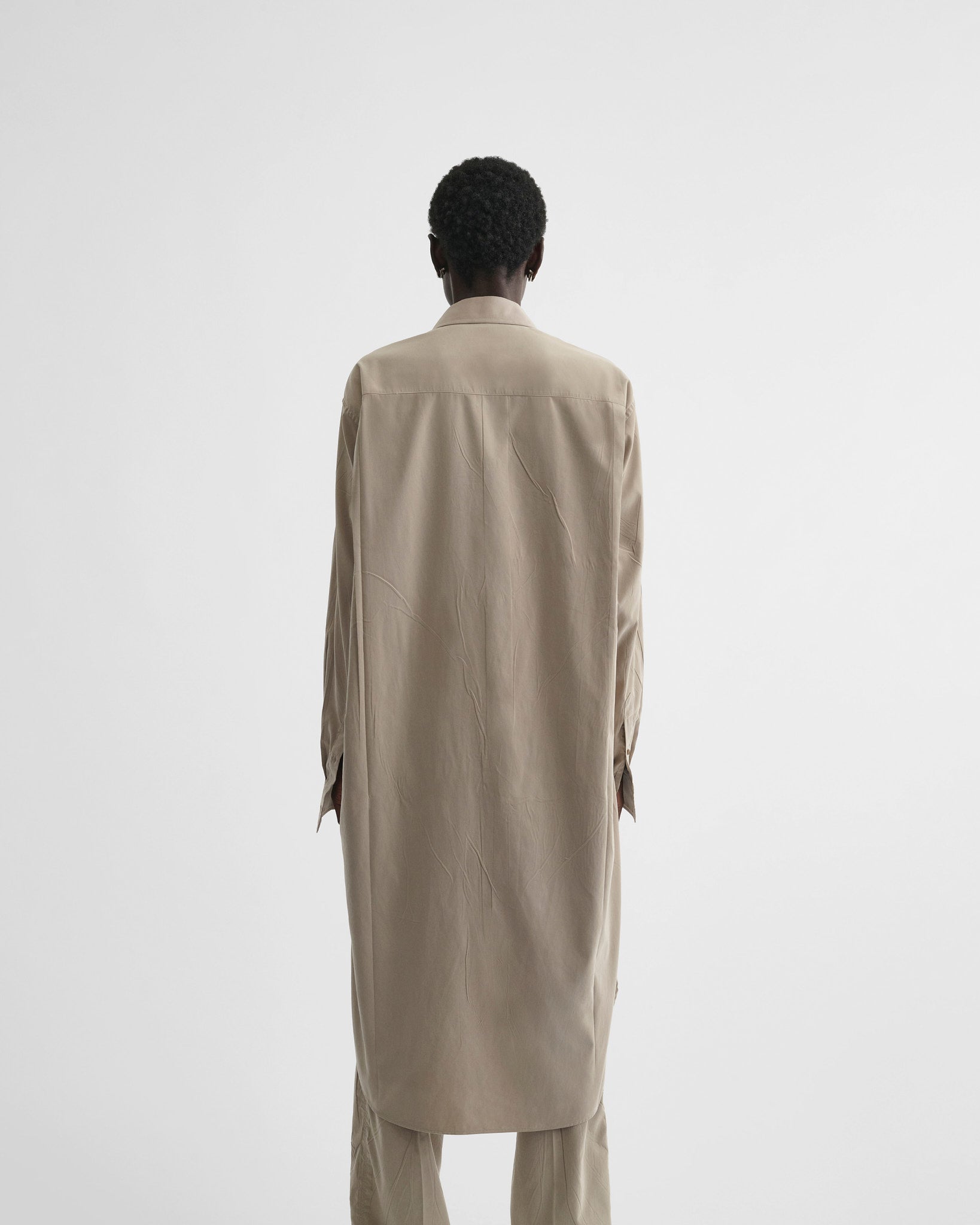 View of elongated shirt in trench poly-twill
