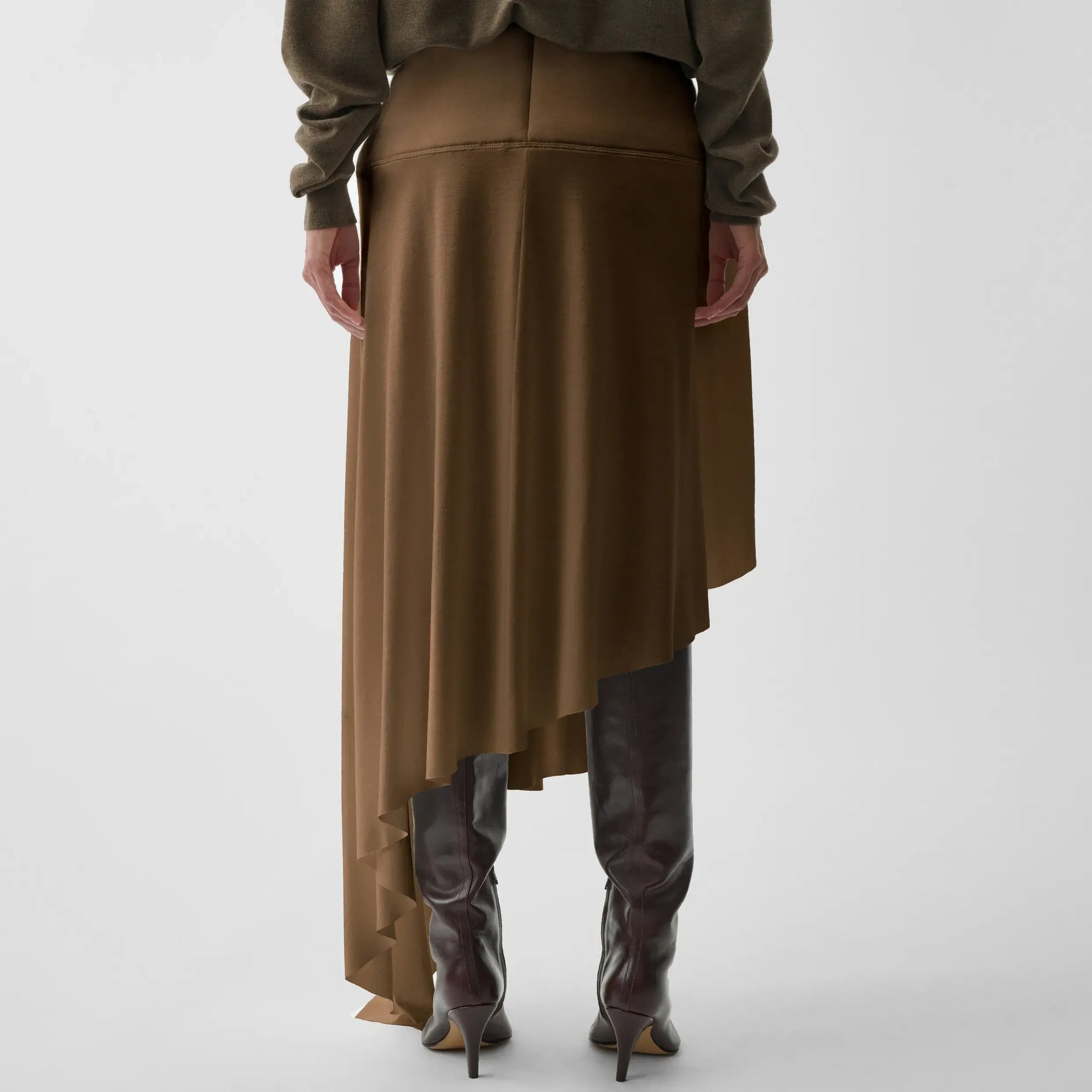 Back view of sculptural skirt in toffee jersey.