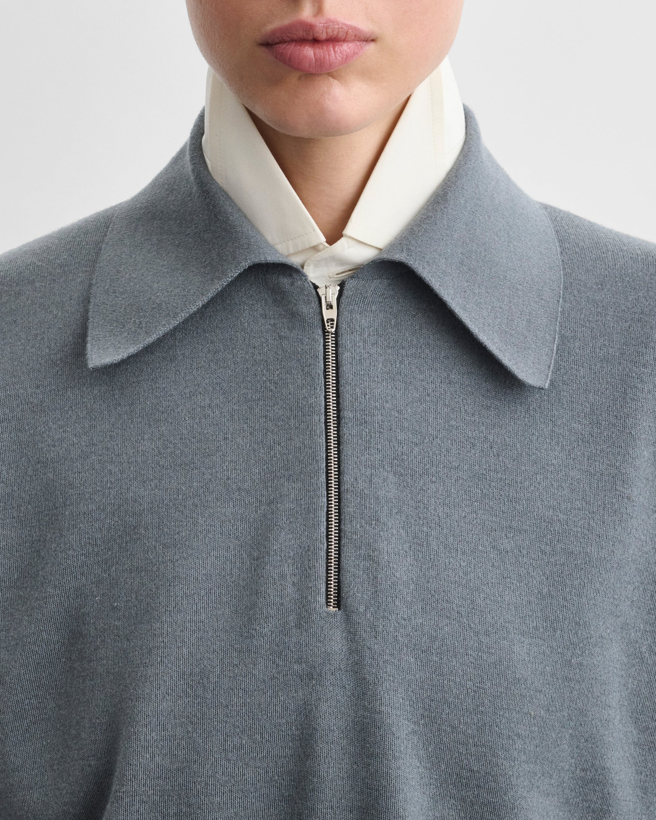 Front detail view of model wearing ZIP POLO in grey blue wool