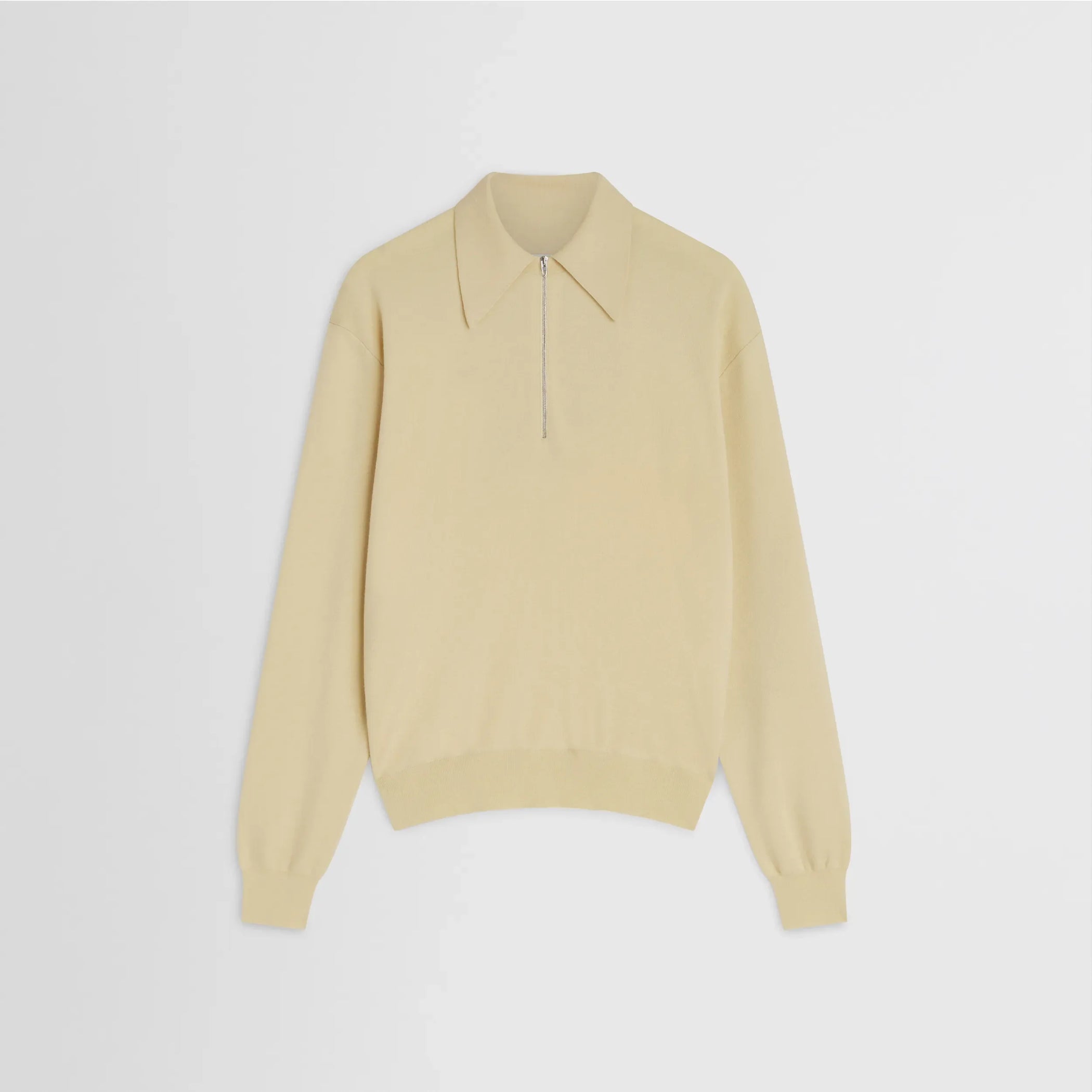 Flat front view of zip polo in pastel-yellow wool