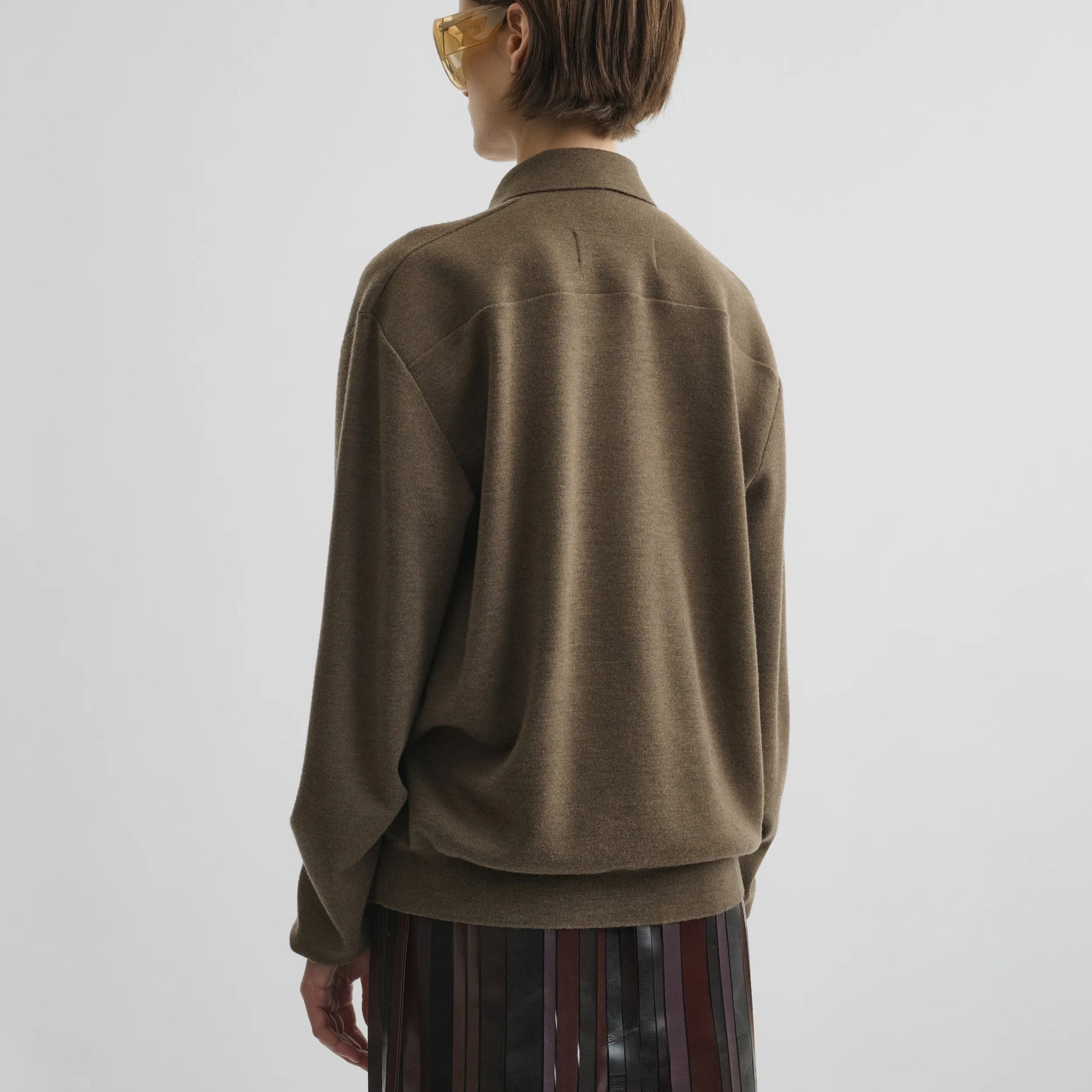 Back view of zip polo in taupe-melange wool