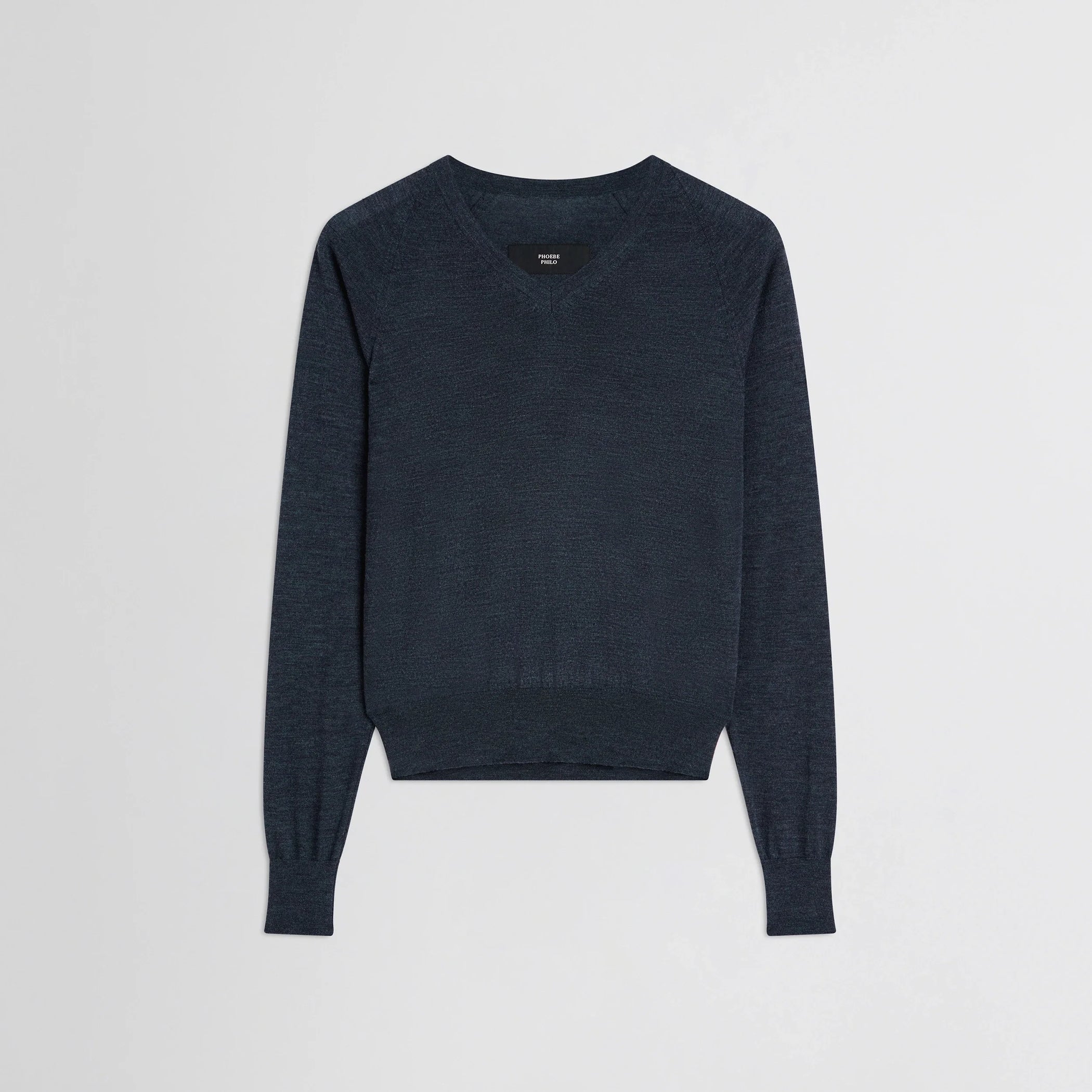 Flat front view of shrunk v-neck in dark blue melange wool.