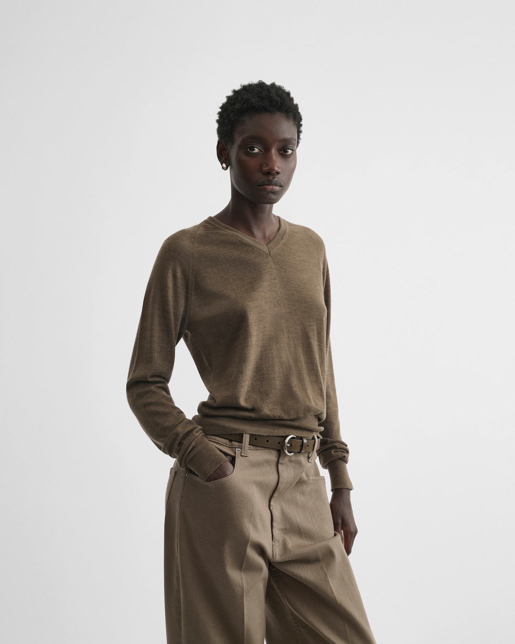 Front view of model wearing shrunk v-neck in taupe wool