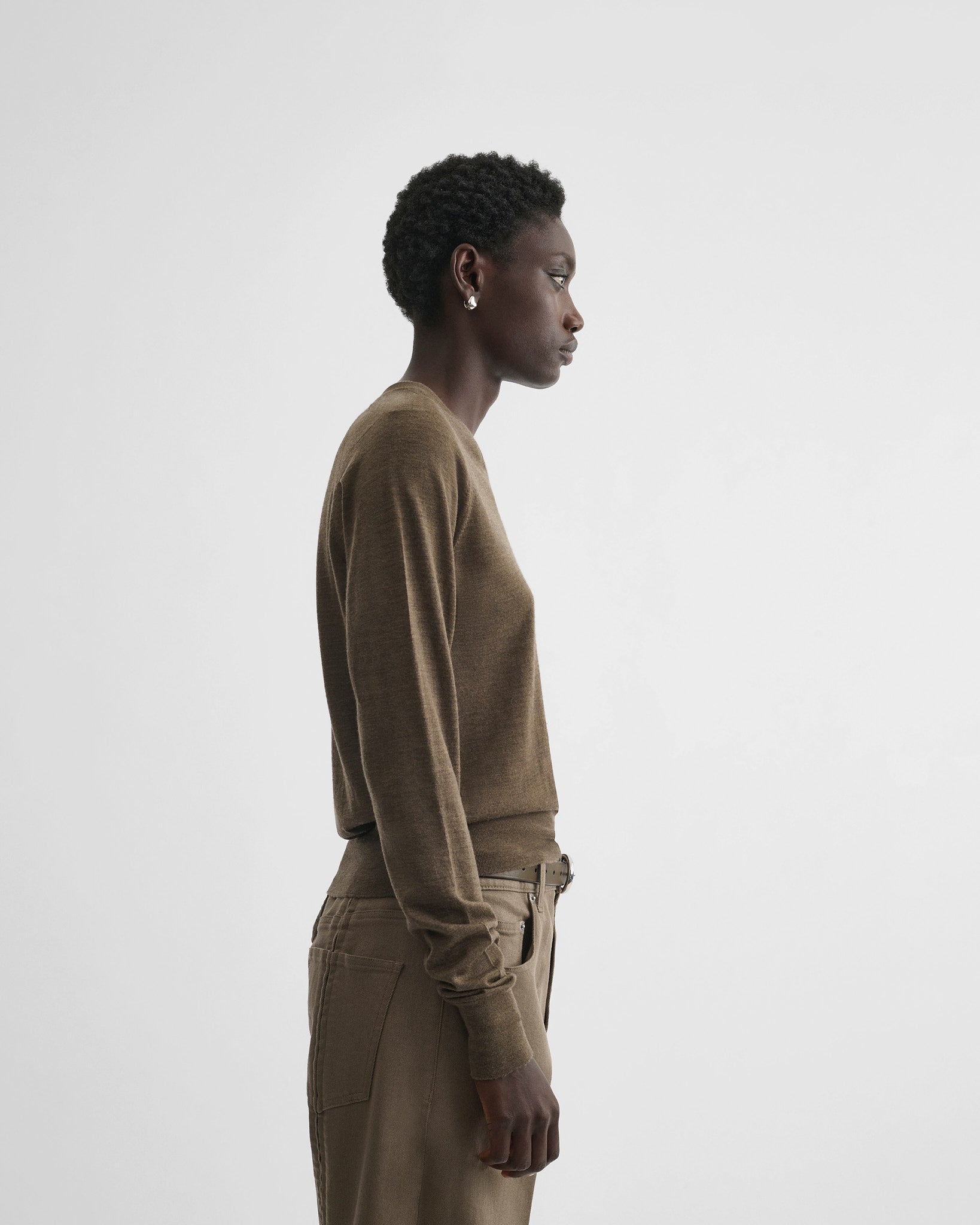 Side view of model wearing shrunk v-neck in taupe wool