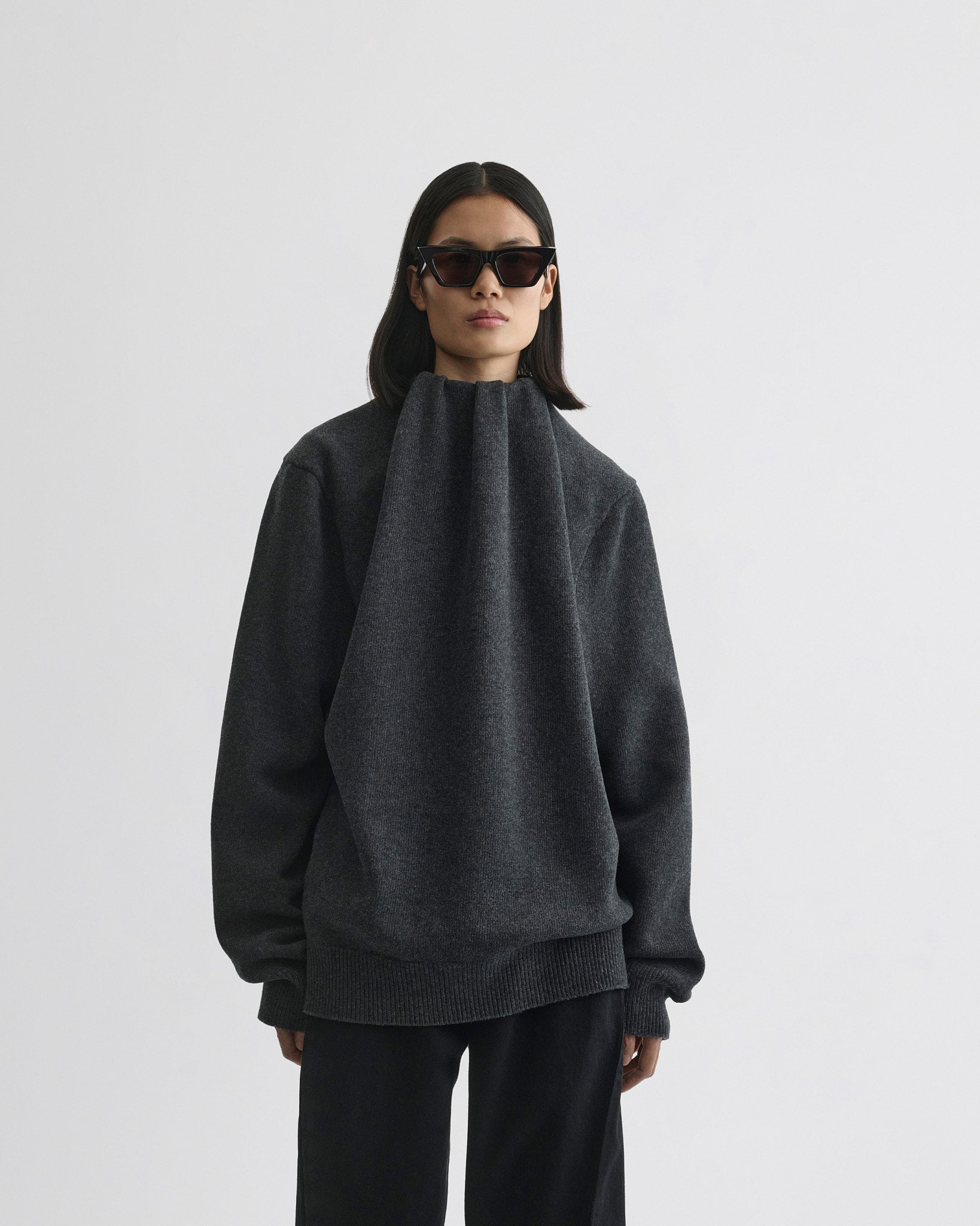 Front view of model wearing SOFT RIDGE JUMPER in grey melange wool