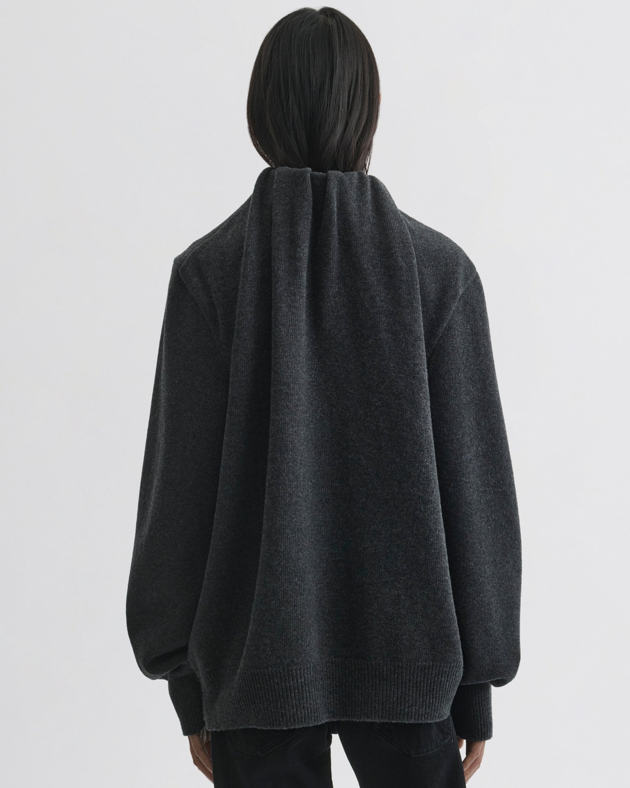 Back view of model wearing SOFT RIDGE JUMPER in grey melange wool