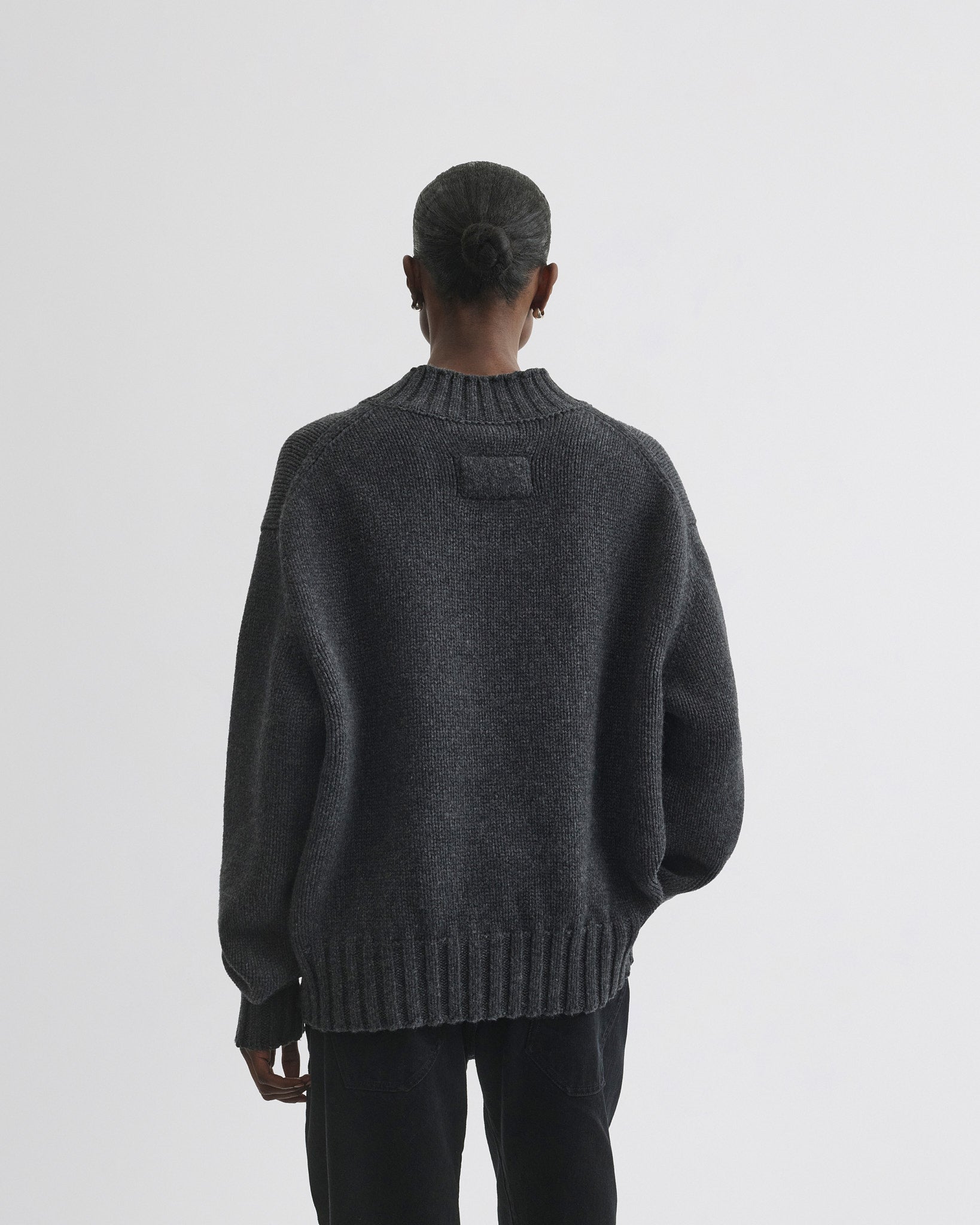Back view of model wearing Crewneck Jumper in grey cashmere