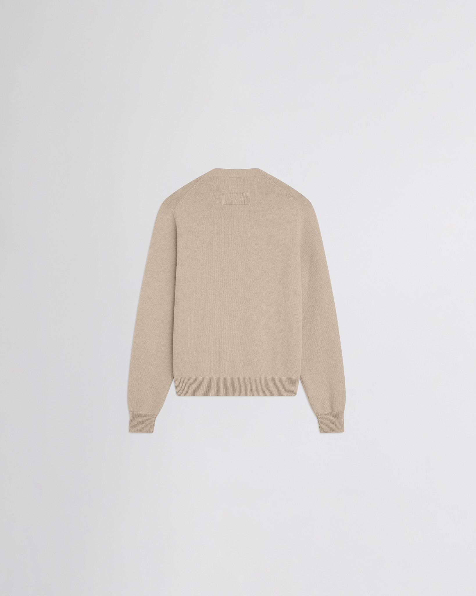 Flat back view of easy v-neck sweater in beige wool cashmere