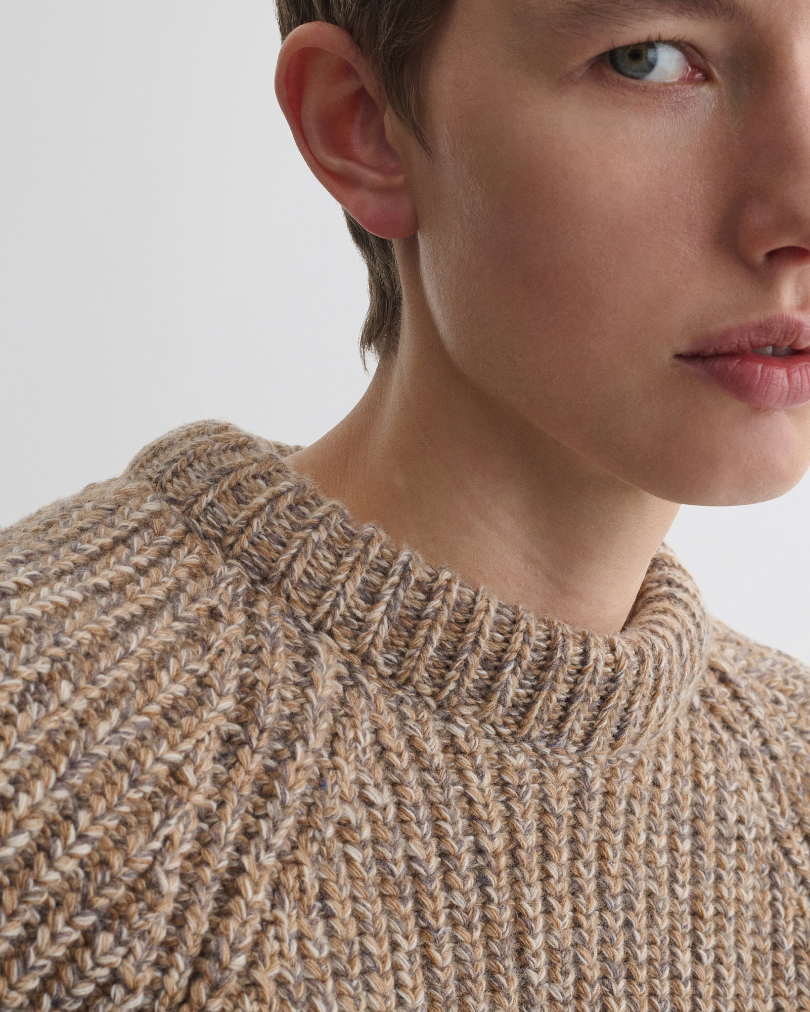 Close up detail view of mouline jumper in camel wool.