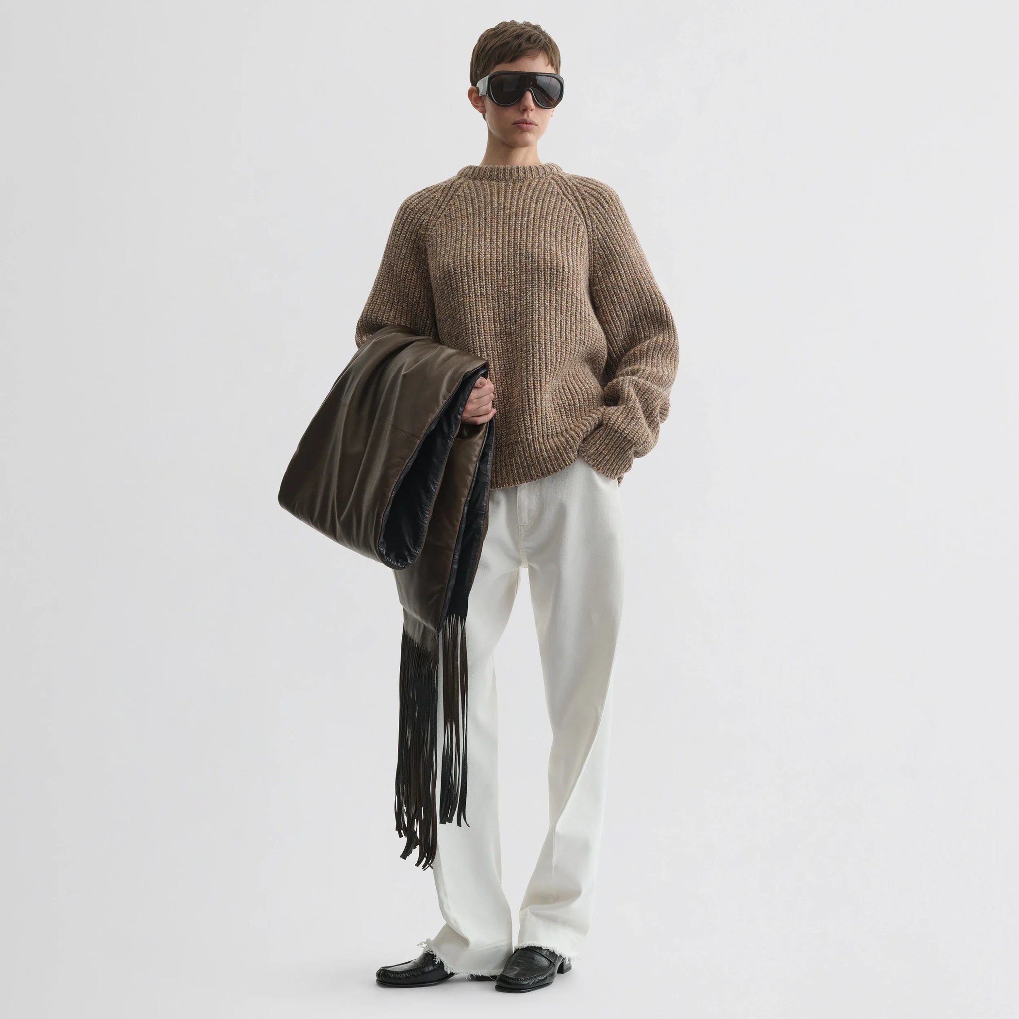 Front view of model wearing mouline jumper in camel wool.