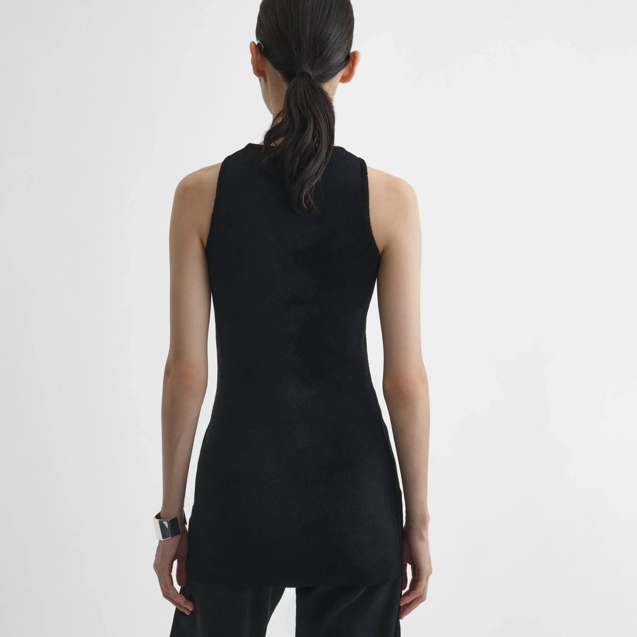 Back view of model wearing Tank Top in black.