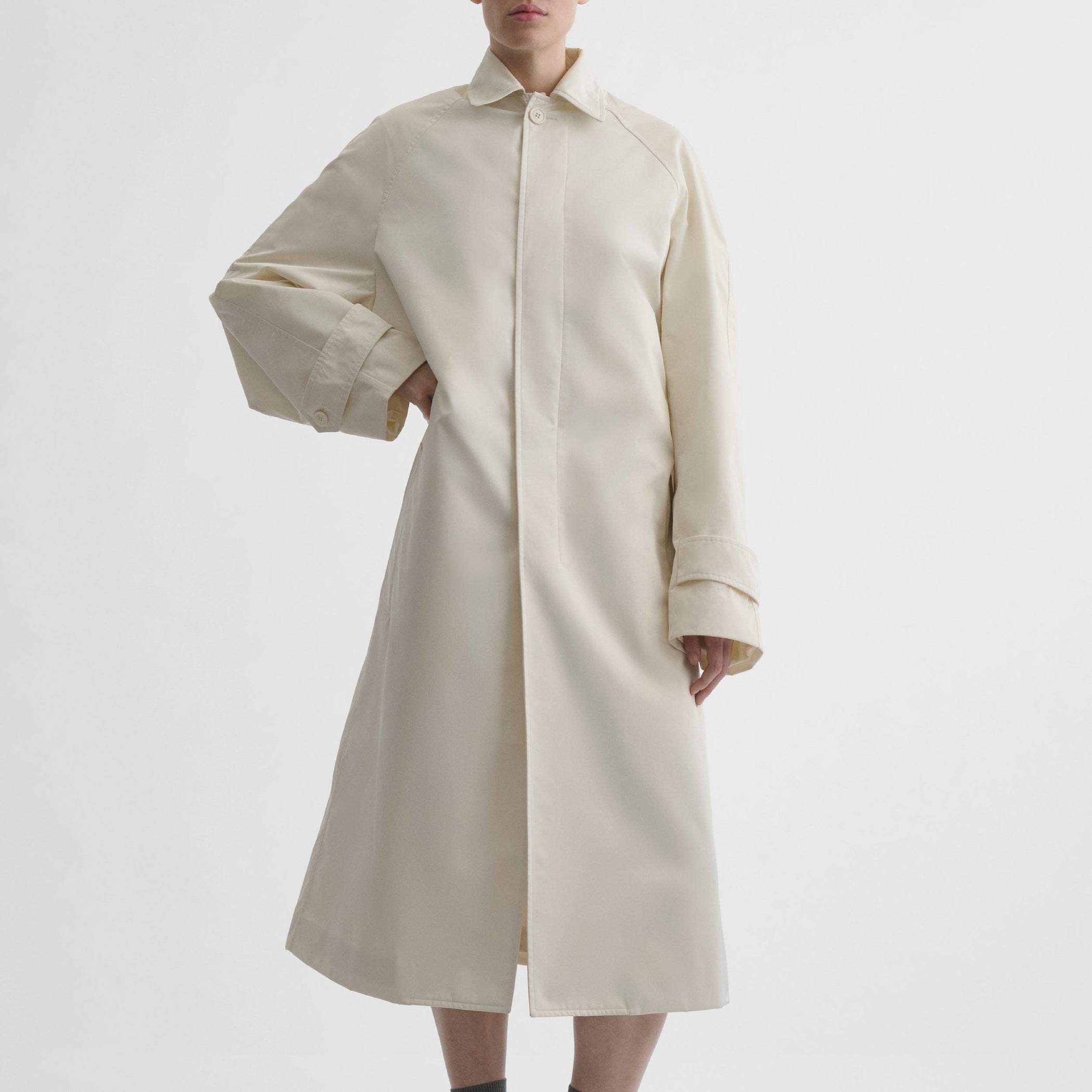 Front view of model wearing COMFY CAR COAT in white blonde technical twill