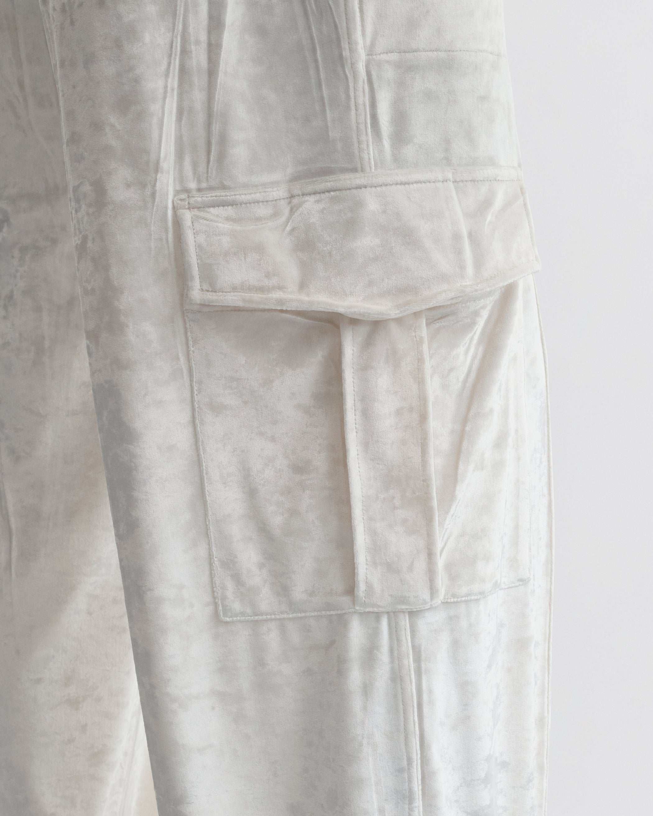 Close up detail view of LIQUID CARGO TROUSERS  in white crushed velvet